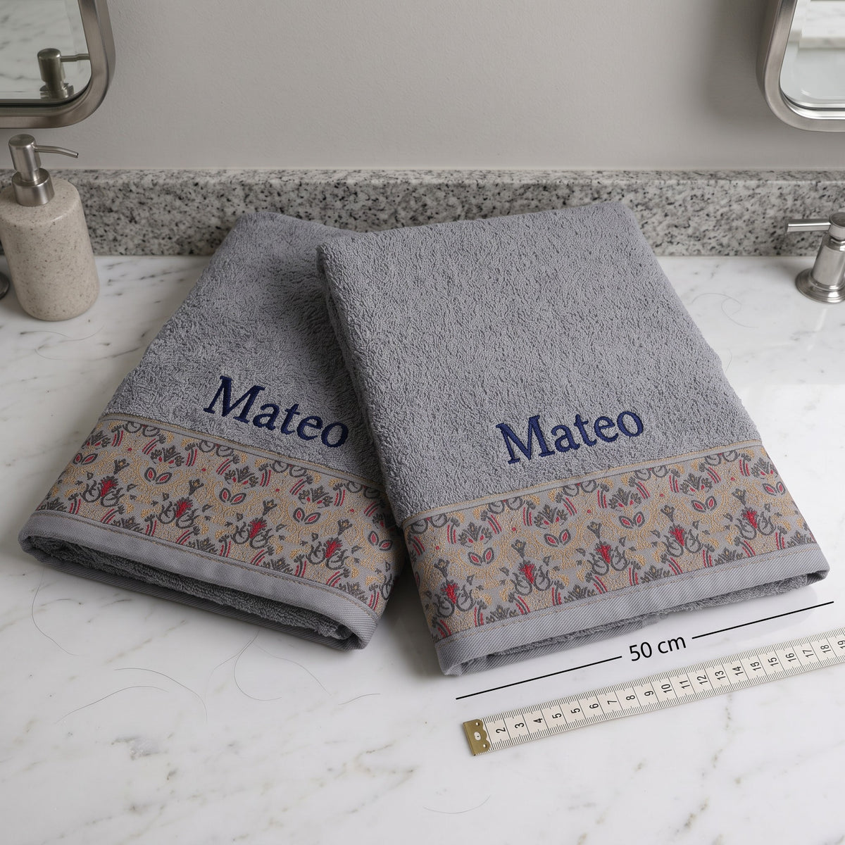 Mateo personalized hair towel, navy serif embroidery on light gray cotton with a patterned border — photo 5