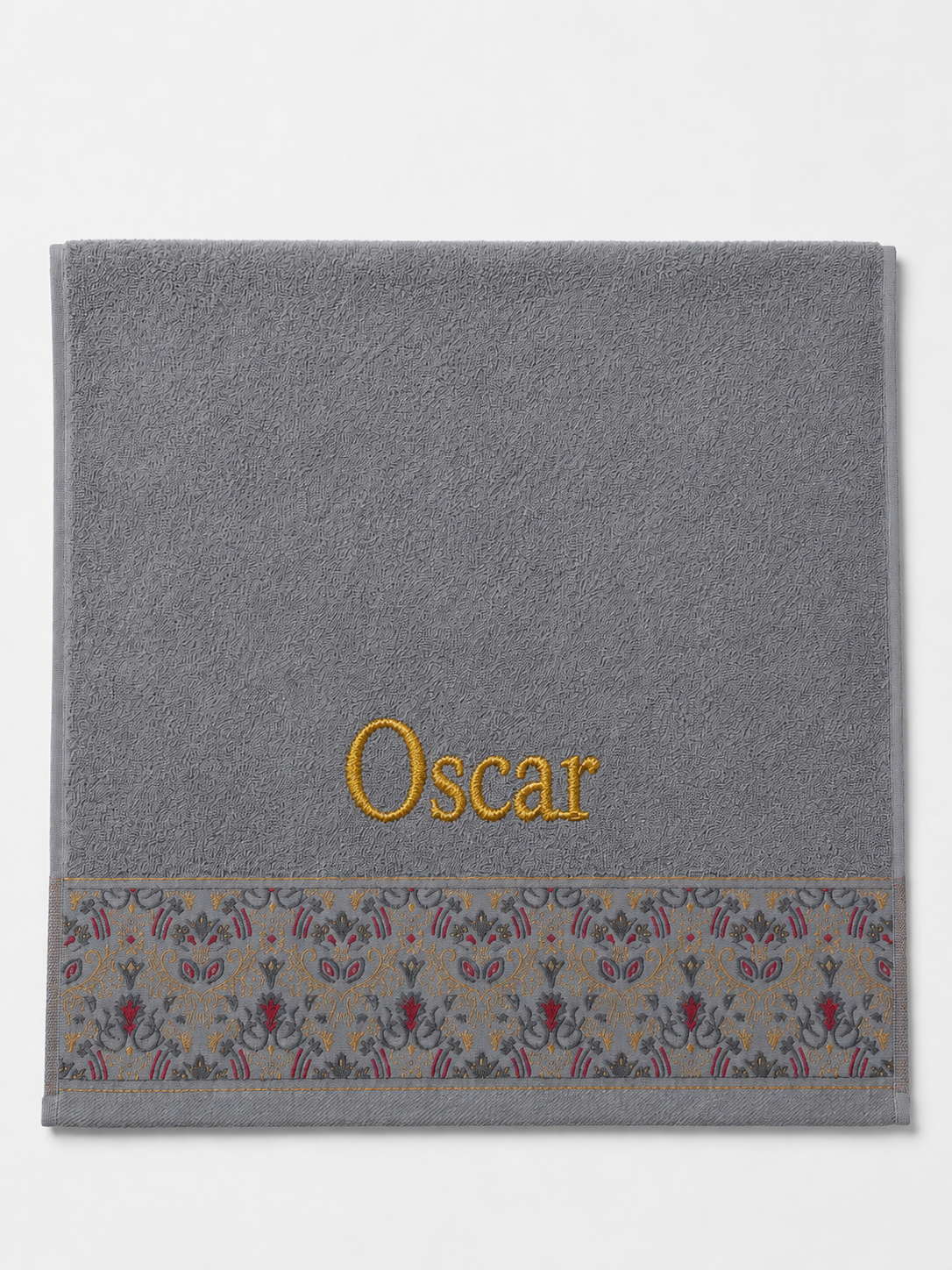 Oscar personalized hair towel, gold serif embroidery on light gray cotton with a patterned border