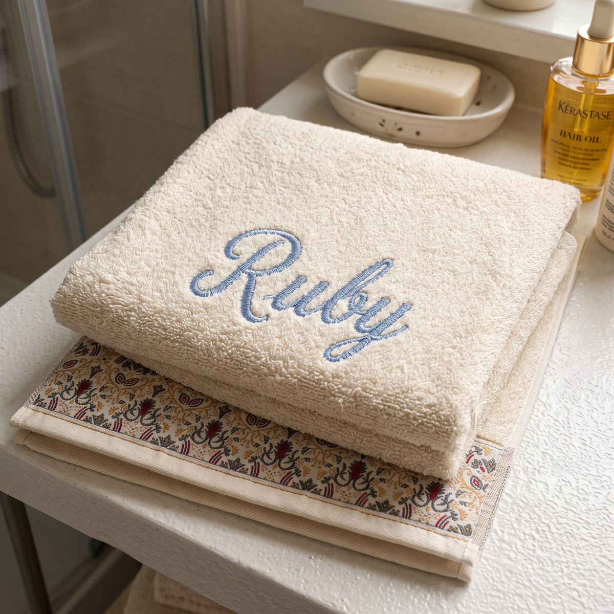 Ruby personalized hair towel, light blue script embroidery on ivory cotton with a patterned border — photo 2
