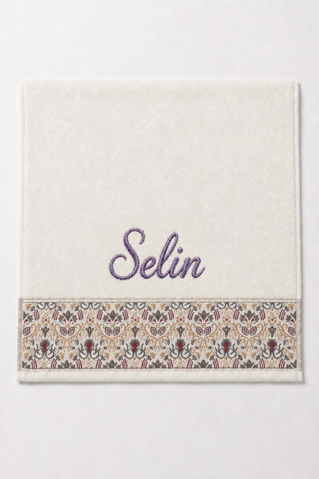 Selin personalized hair towel, purple script embroidery on ivory cotton with a patterned border