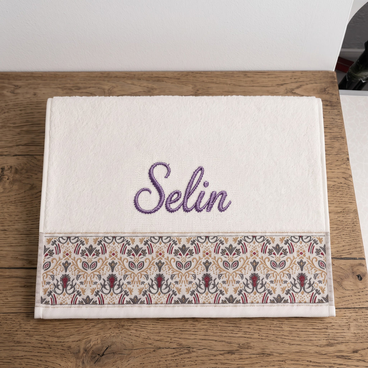 Selin personalized hair towel, purple script embroidery on ivory cotton with a patterned border — photo 2