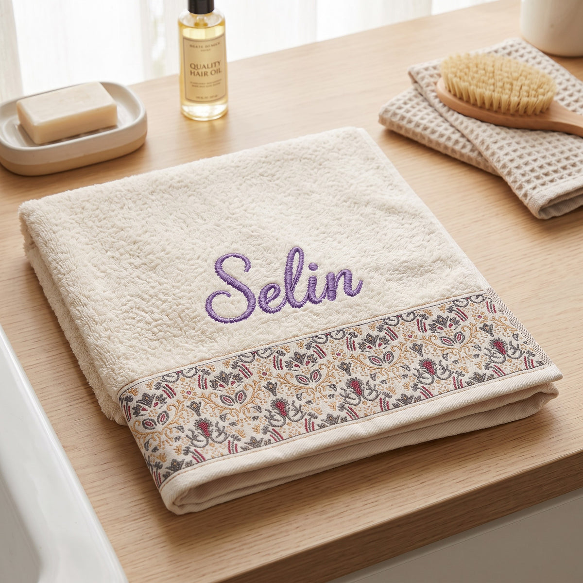 Selin personalized hair towel, purple script embroidery on ivory cotton with a patterned border — photo 4