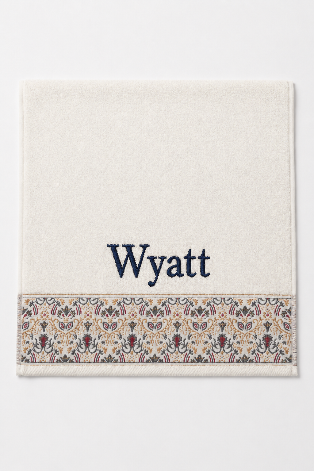 Wyatt personalized hair towel, navy serif embroidery on ivory cotton with a patterned border