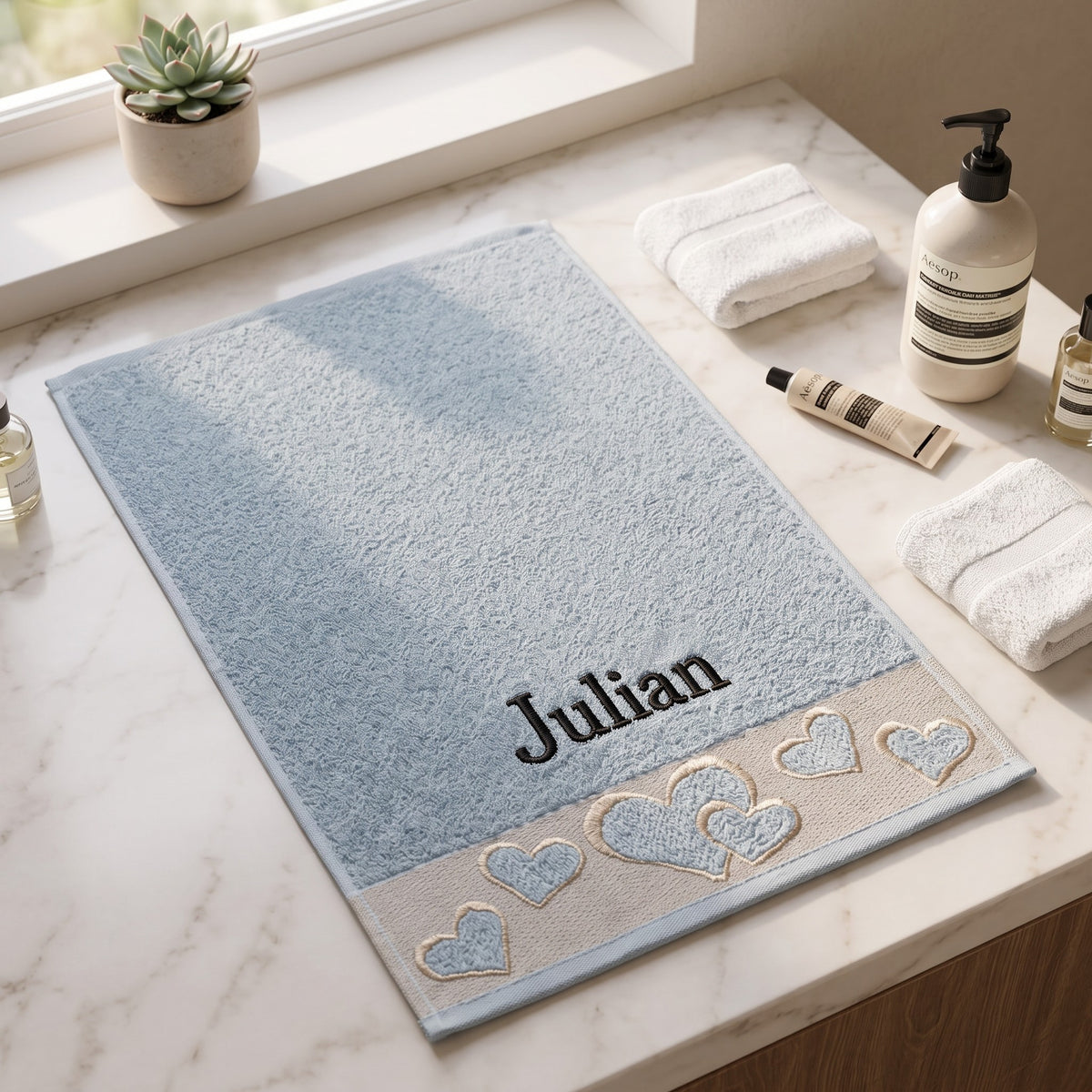 Julian personalized heart hand towel, black serif embroidery on baby blue cotton — photo 2