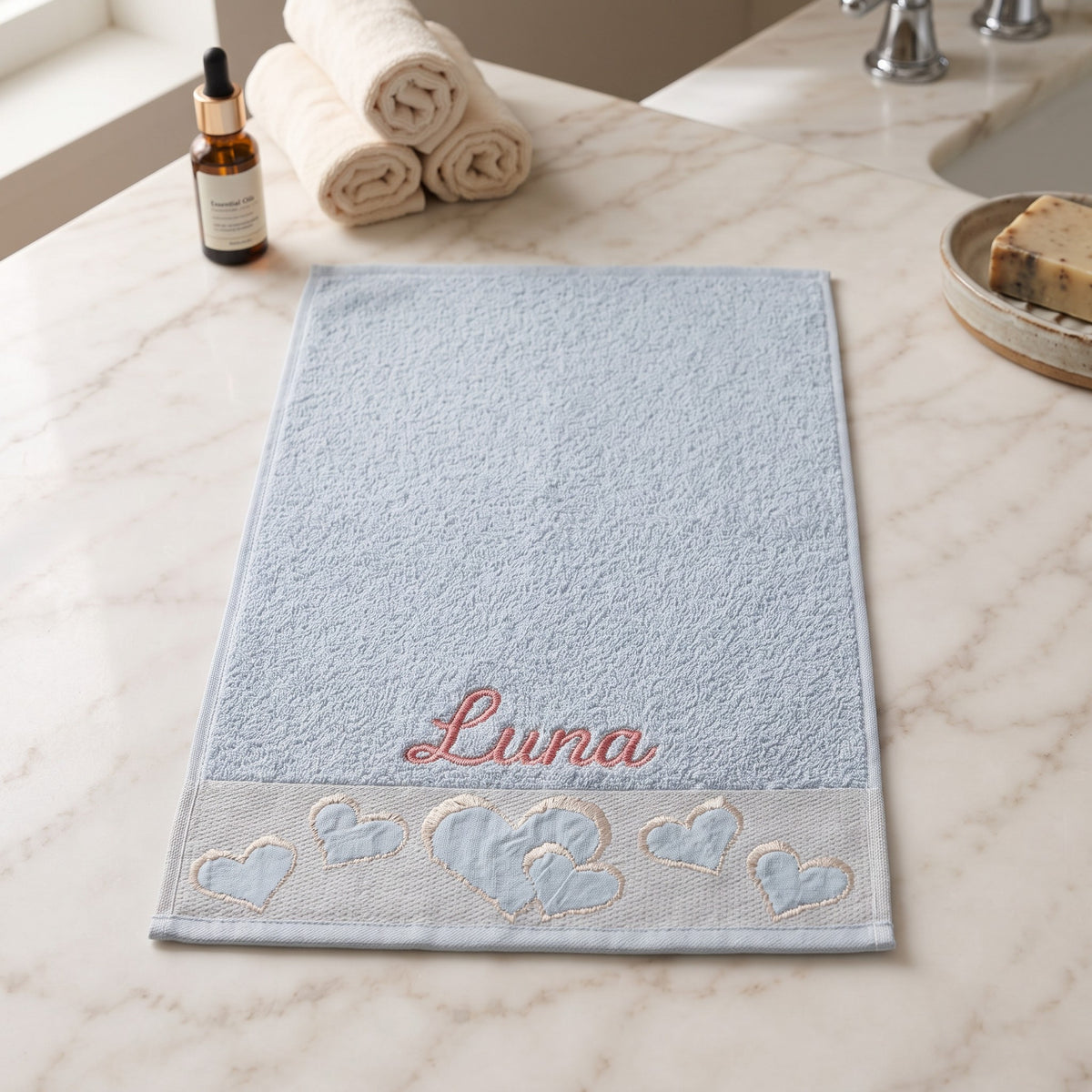 Luna personalized heart hand towel, coral pink script embroidery on baby blue cotton — photo 2