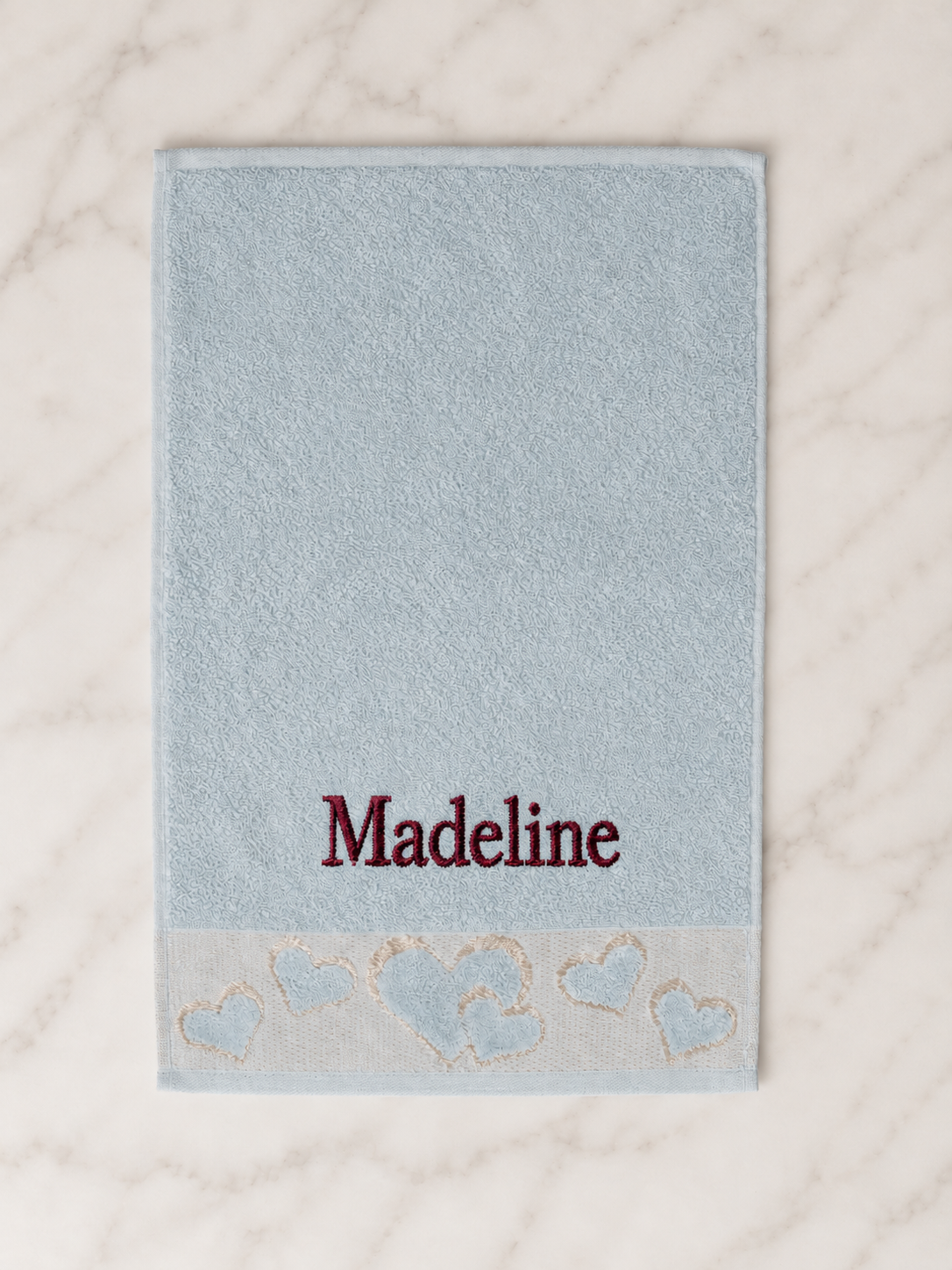 Madeline personalized heart hand towel, burgundy serif embroidery on baby blue cotton