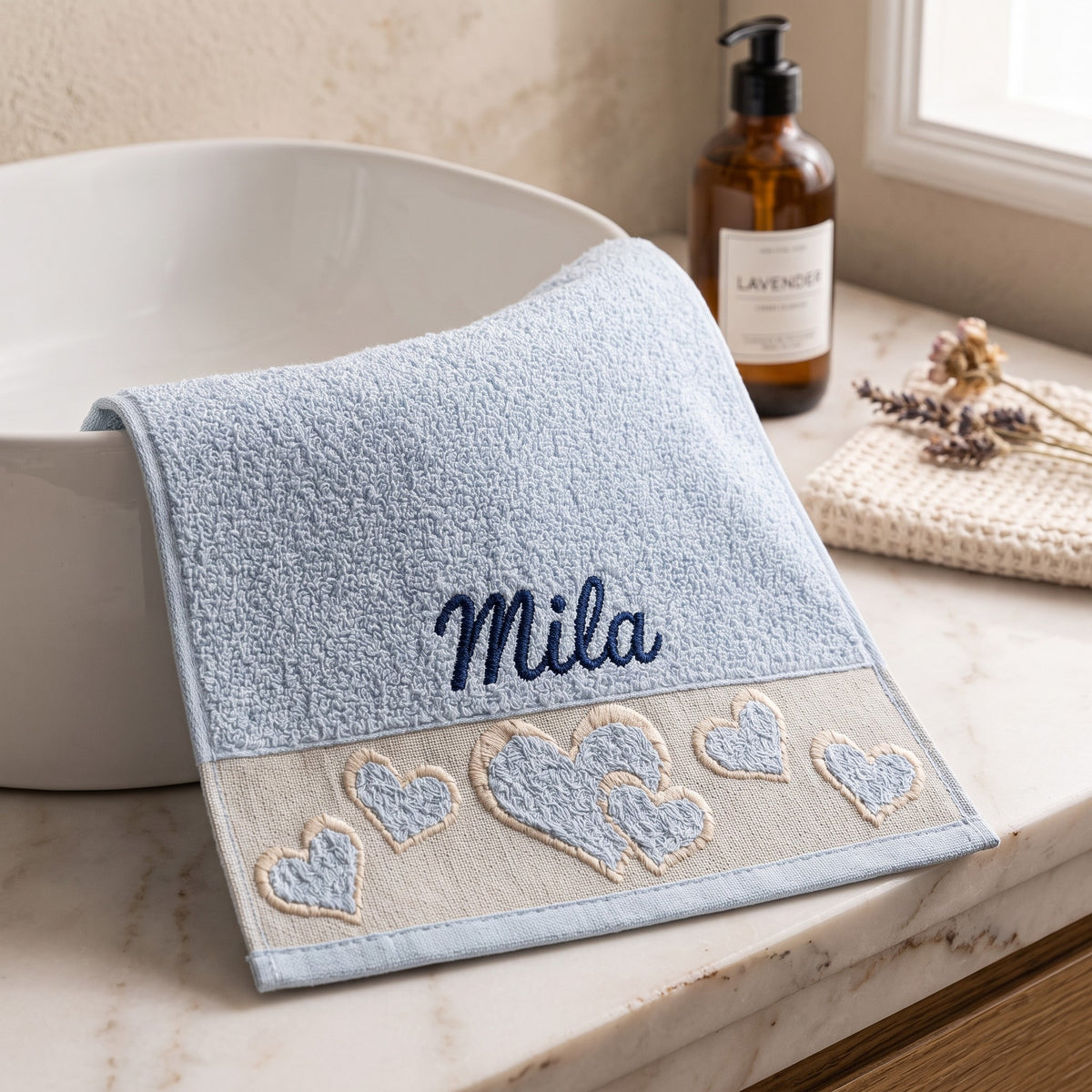 Mila personalized heart hand towel, navy script embroidery on baby blue cotton — photo 2