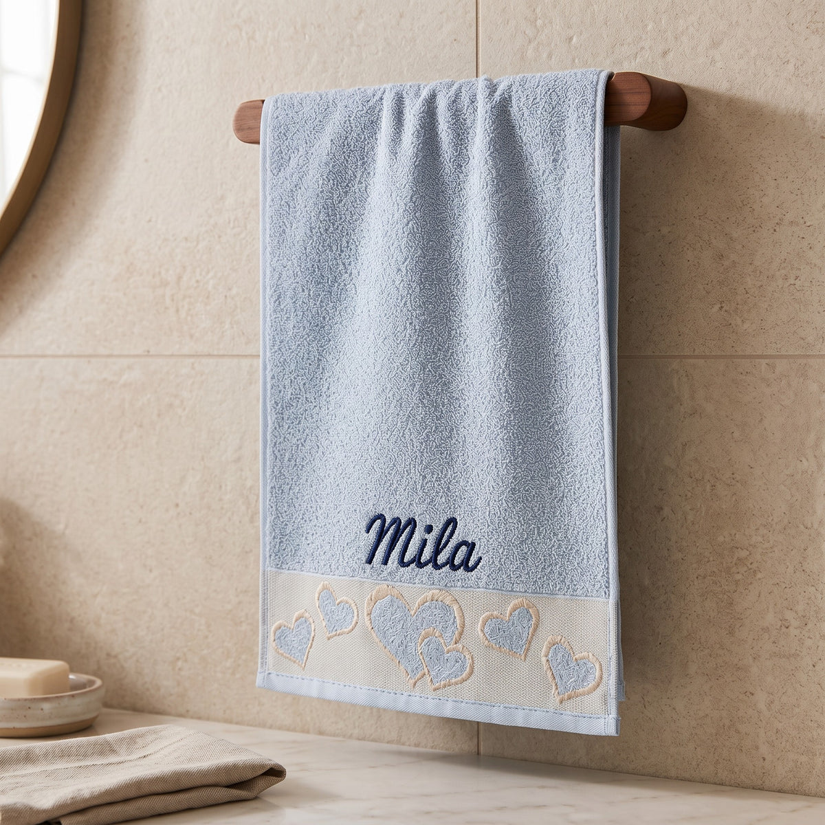 Mila personalized heart hand towel, navy script embroidery on baby blue cotton — photo 3