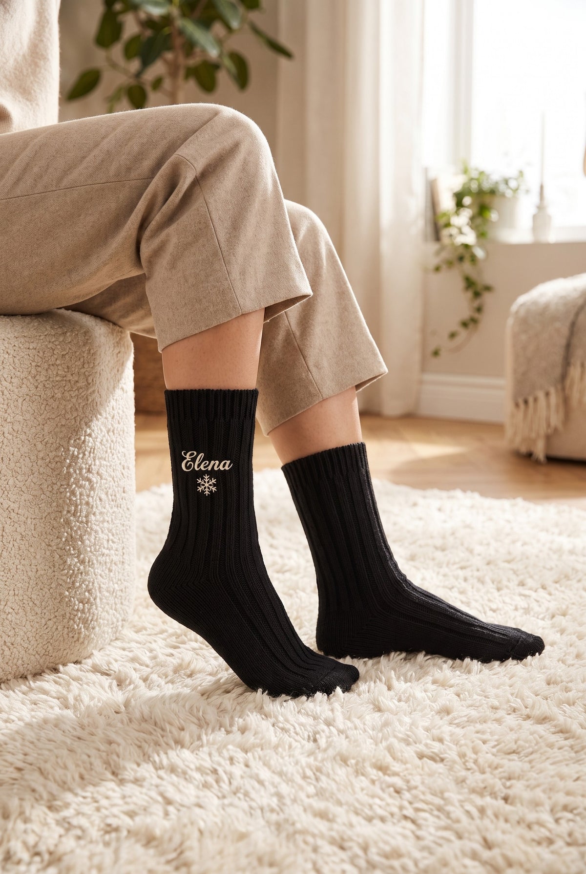 Model wearing black embroidered women's wool socks
