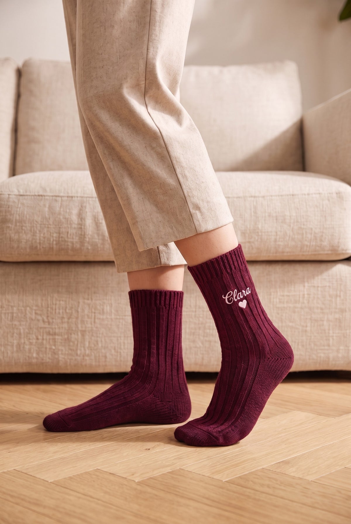 Model wearing burgundy embroidered women's wool socks, second view