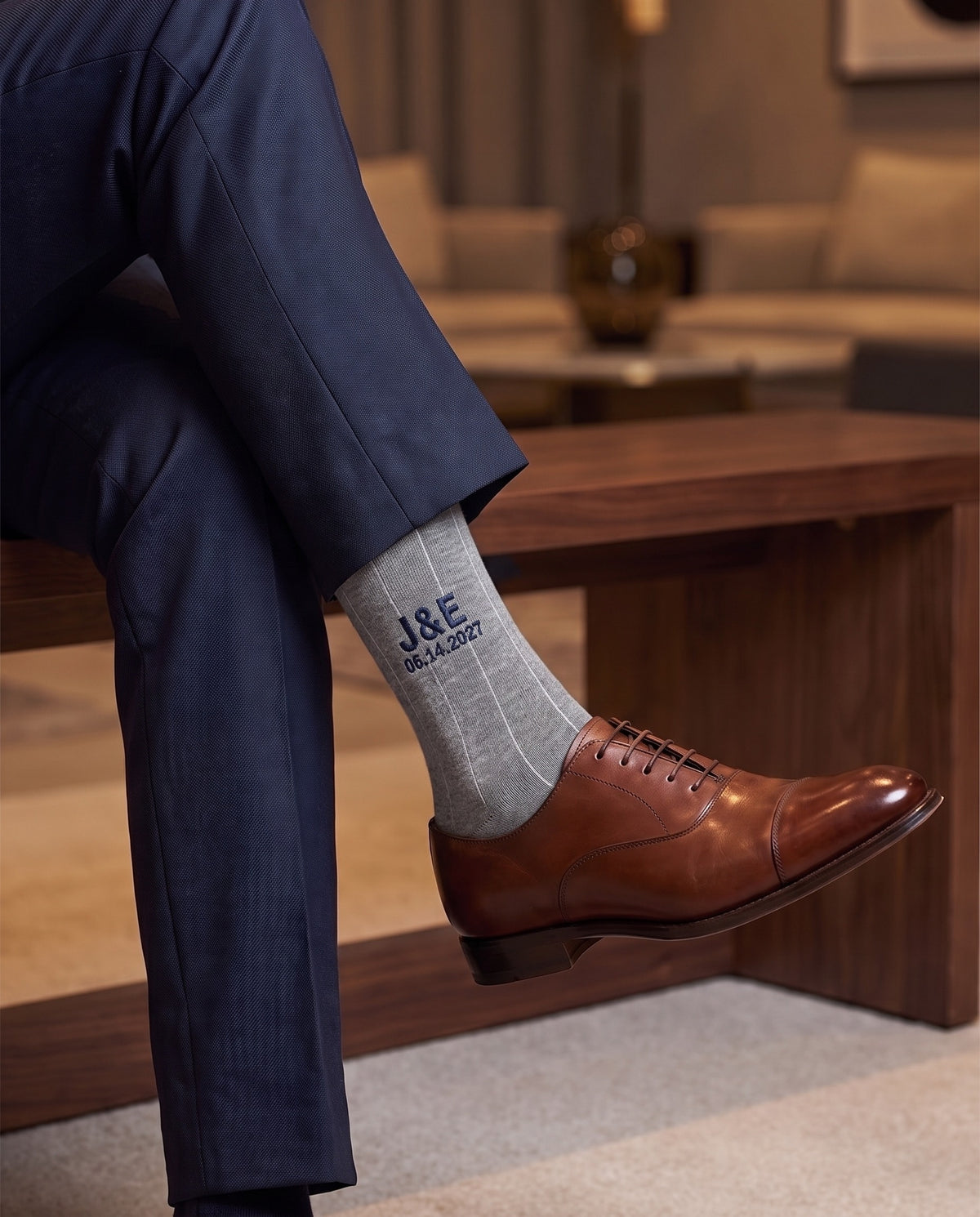 Model wearing light grey melange embroidered groom dress socks