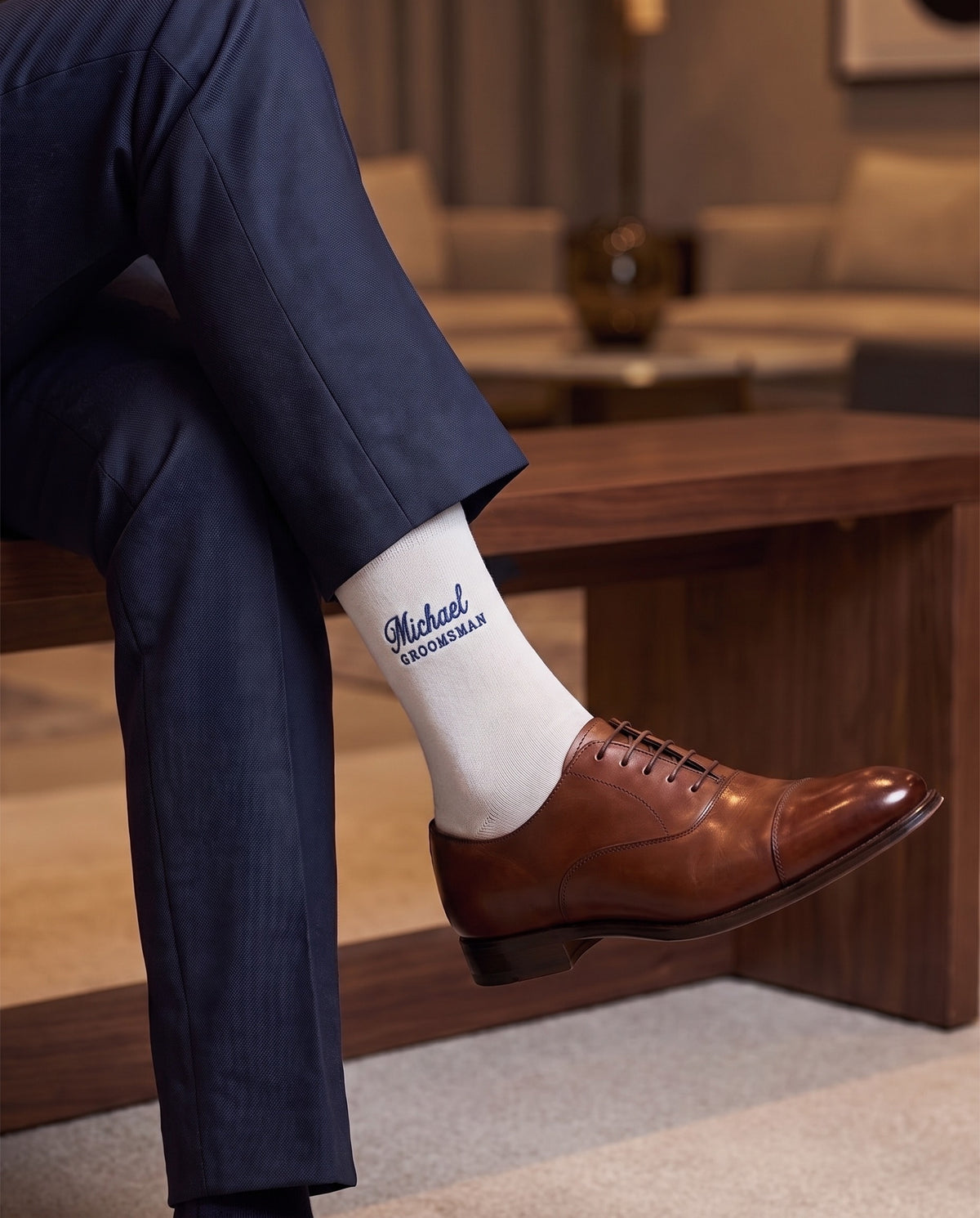 Model wearing white embroidered groom dress socks