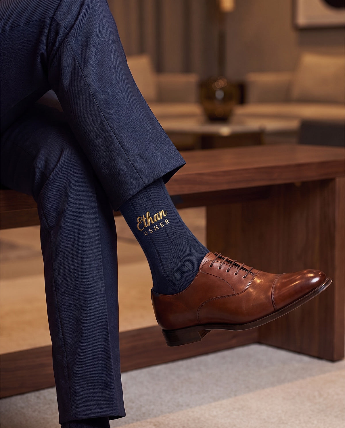 Model wearing navy embroidered groom dress socks