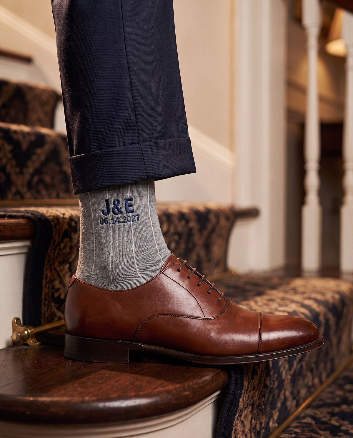 Model wearing light grey melange embroidered groom dress socks, second view