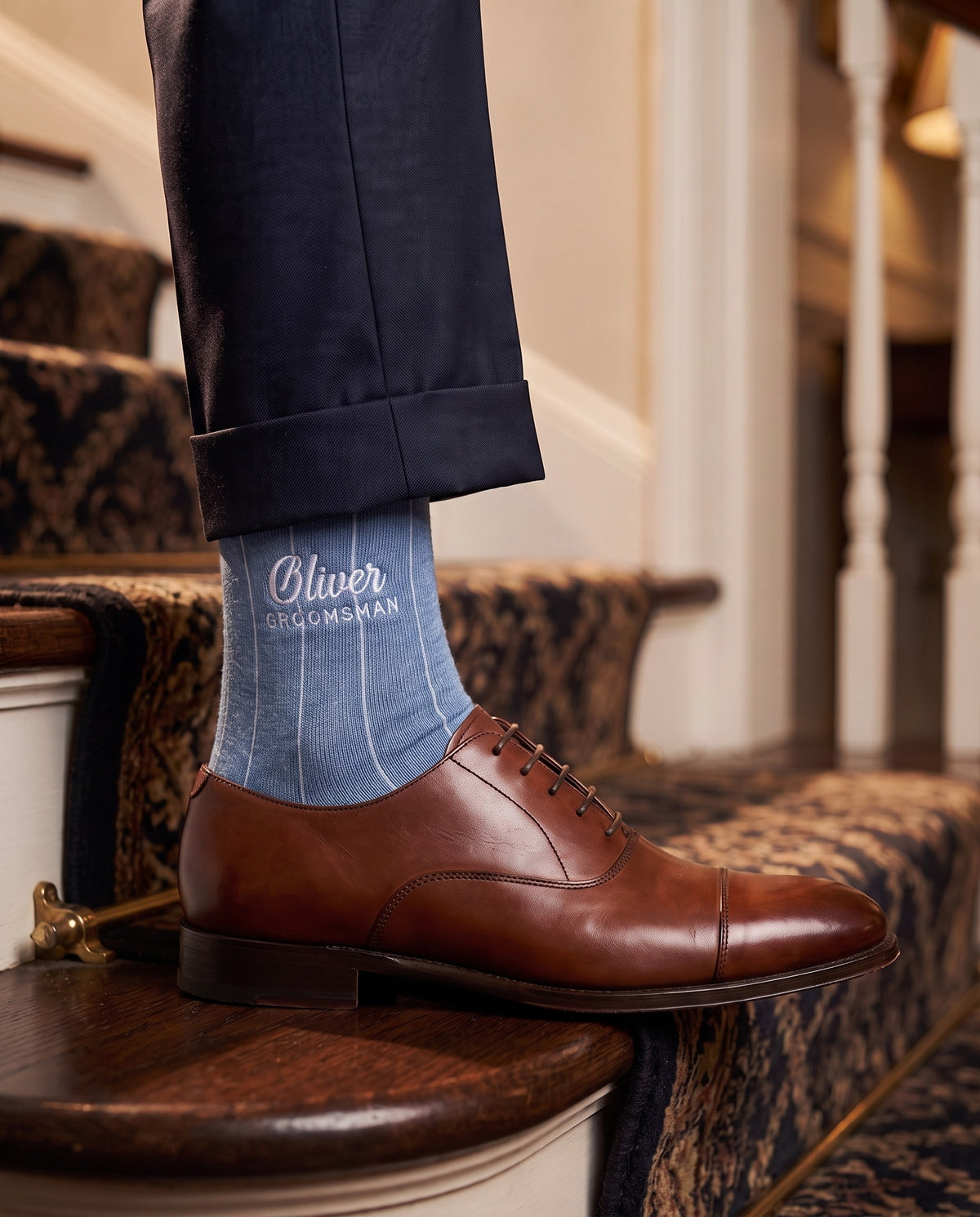Model wearing indigo melange embroidered groom dress socks, second view