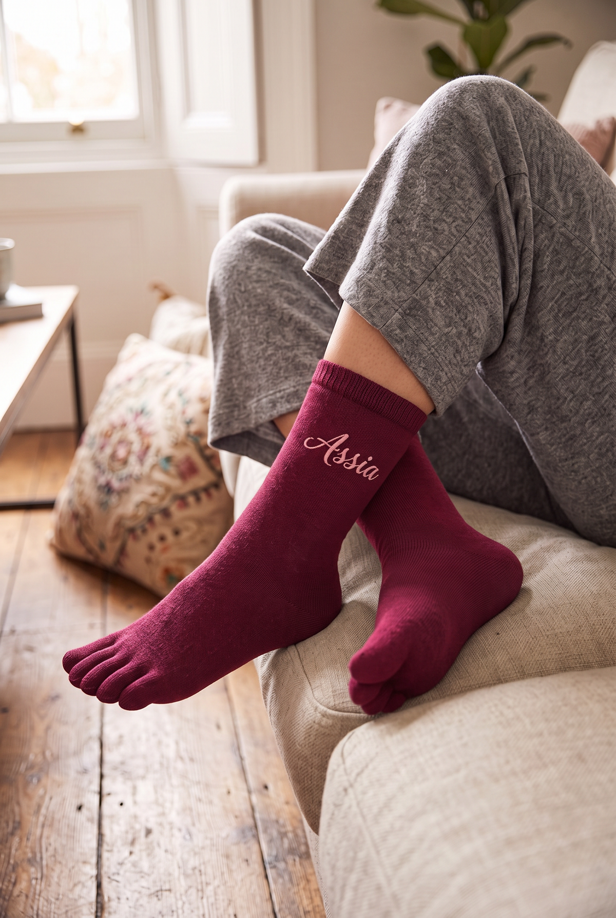 Model wearing burgundy embroidered toe socks