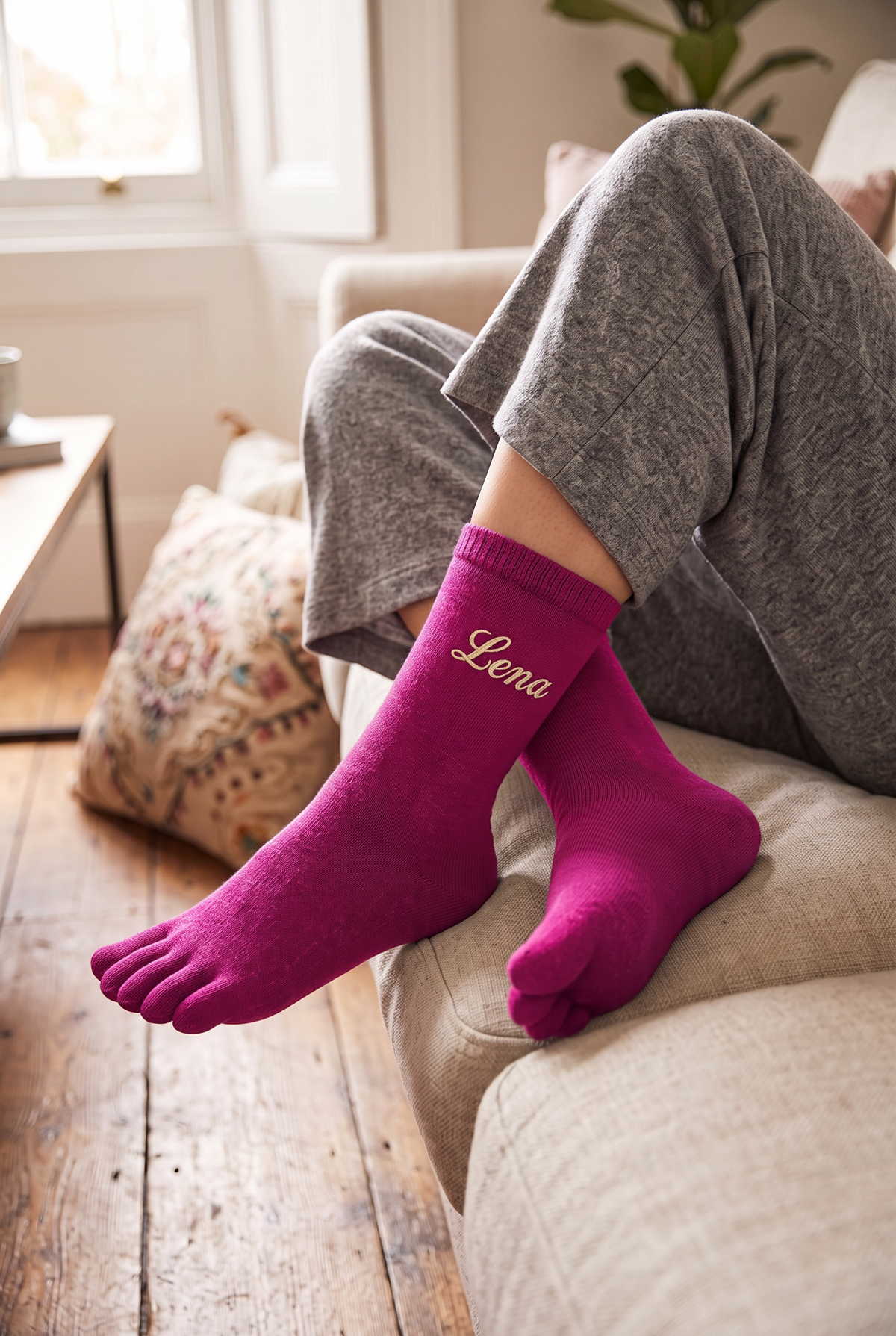 Model wearing fuchsia embroidered toe socks