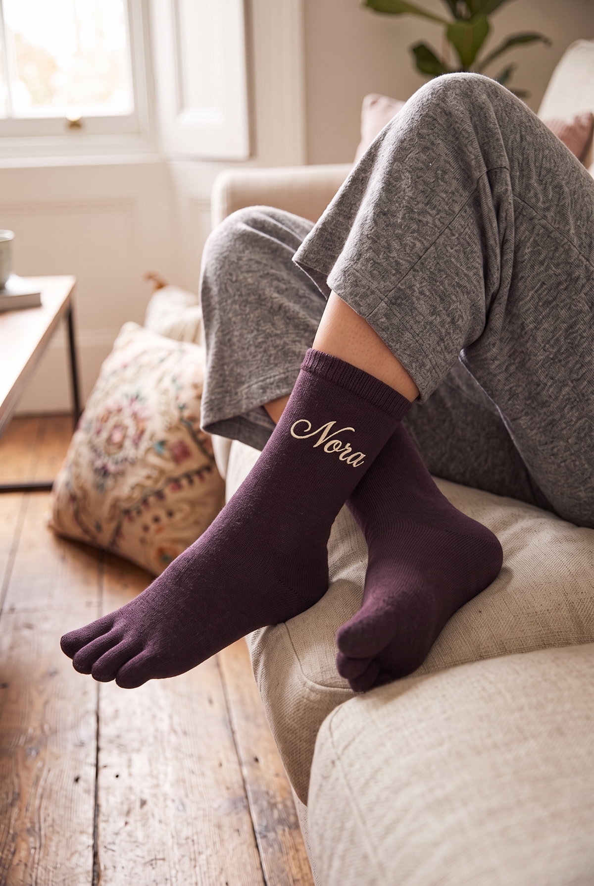 Model wearing dark brown embroidered toe socks