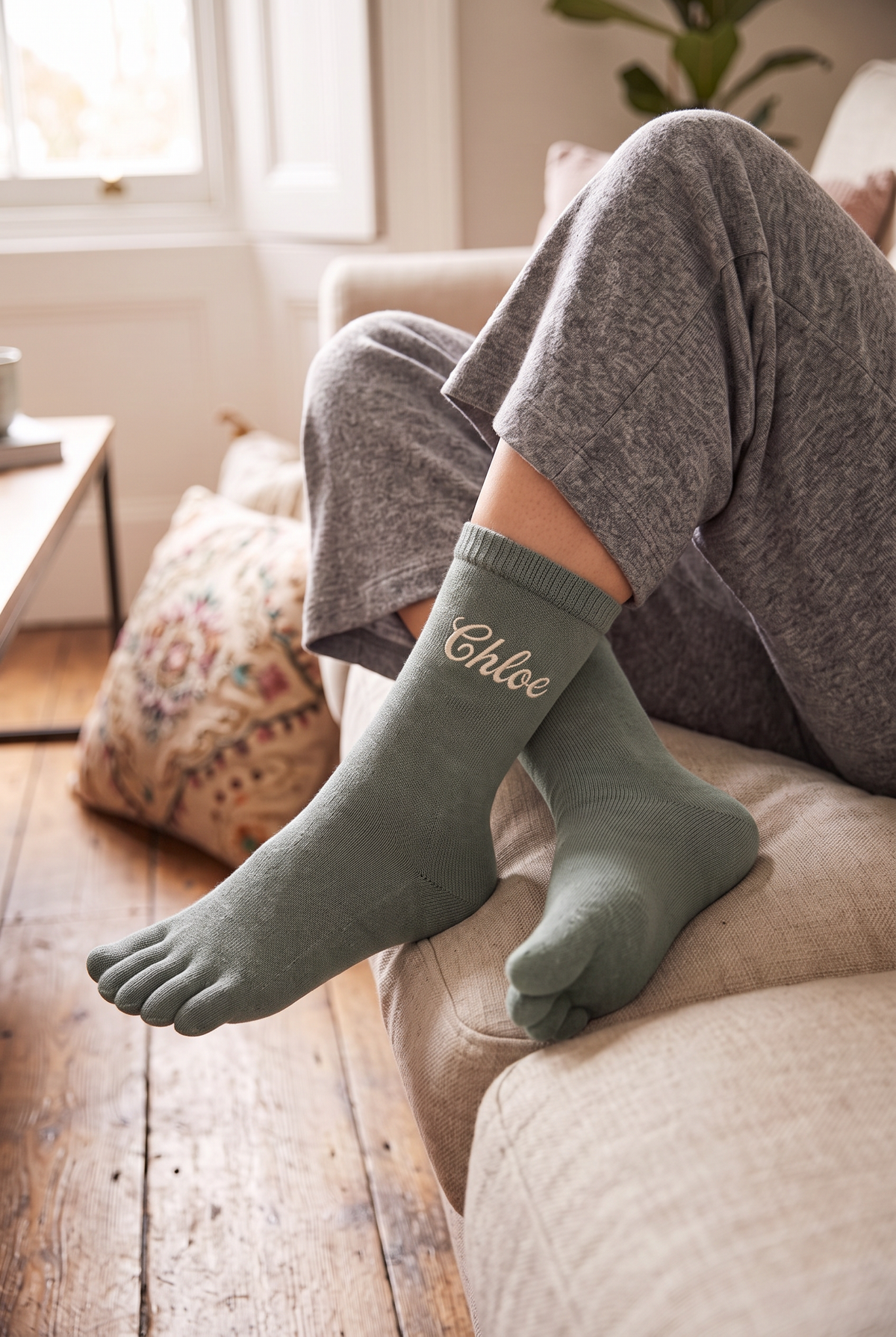 Model wearing dark green embroidered toe socks