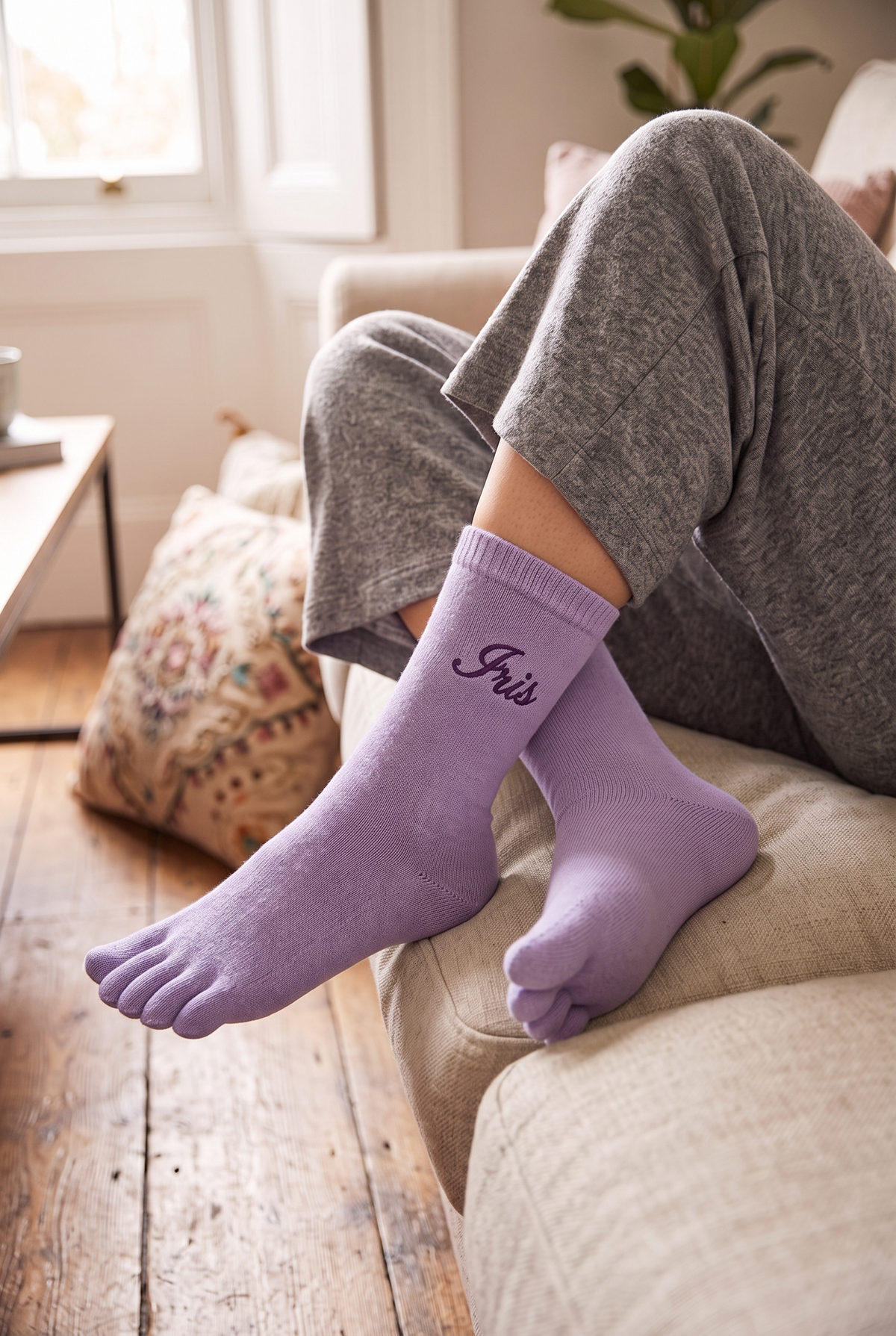 Model wearing lilac embroidered toe socks
