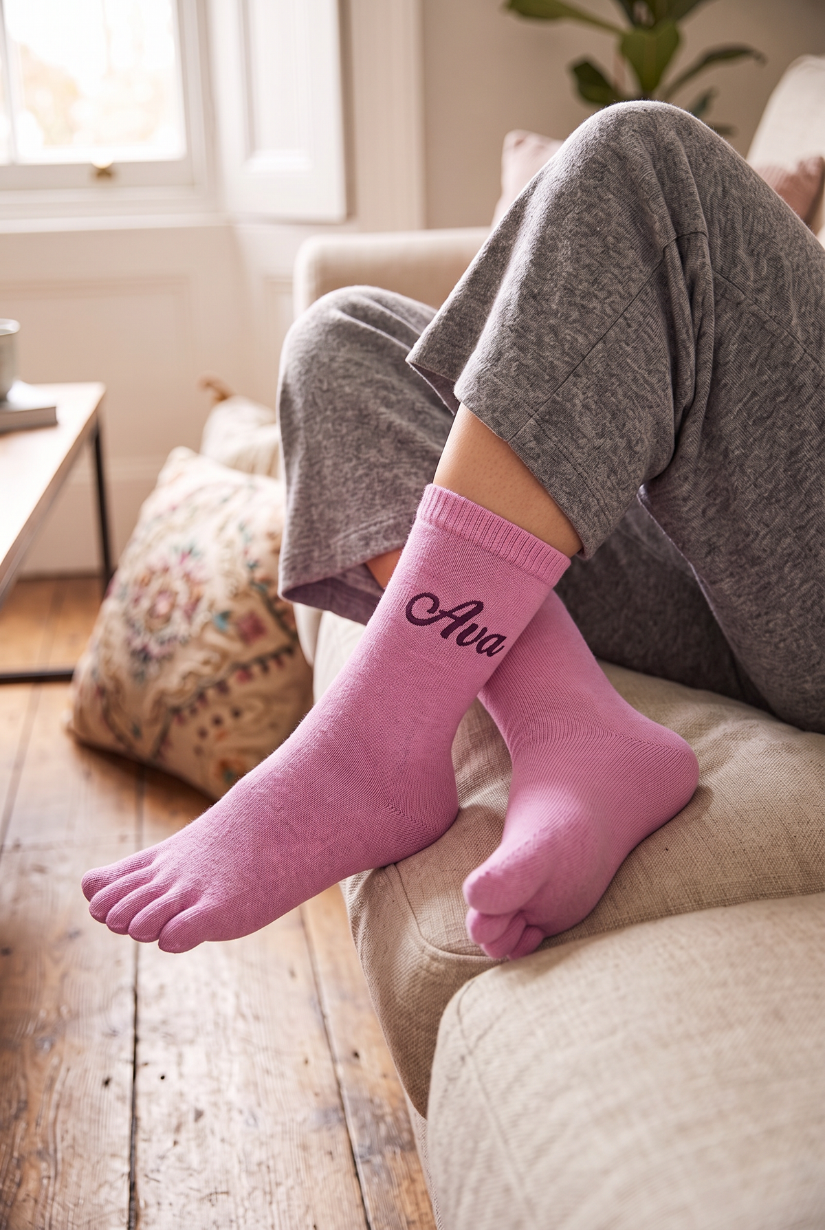 Model wearing pink embroidered toe socks