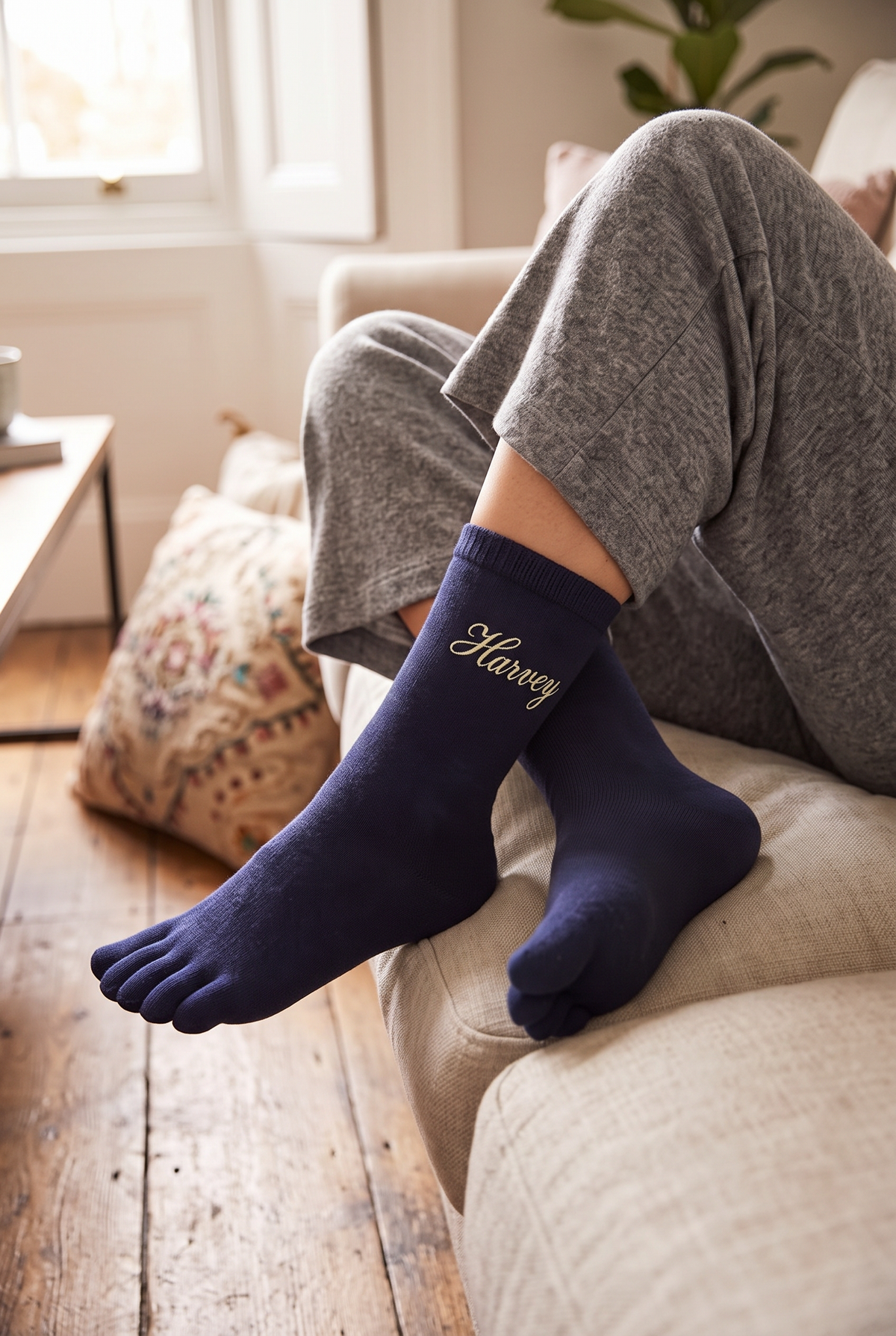 Model wearing black embroidered toe socks