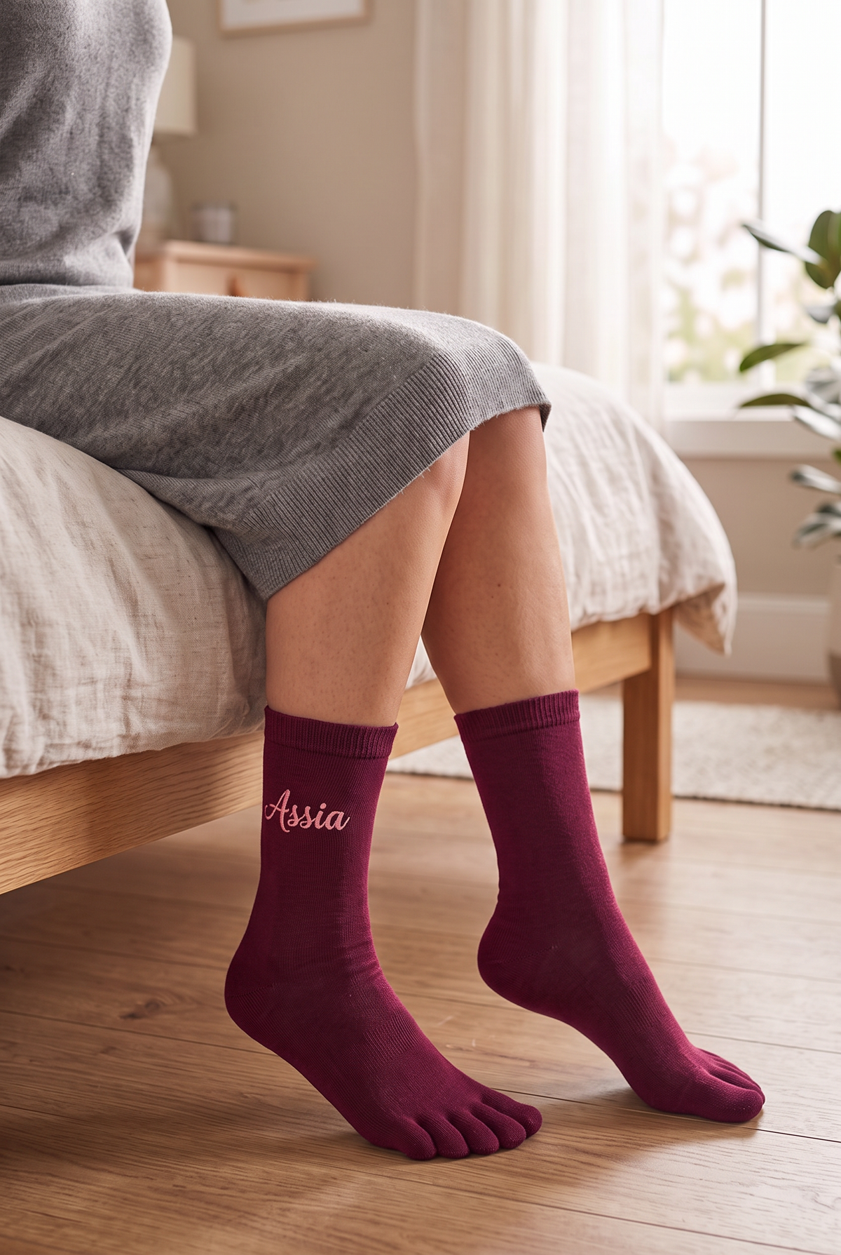 Model wearing burgundy embroidered toe socks, seen from the side