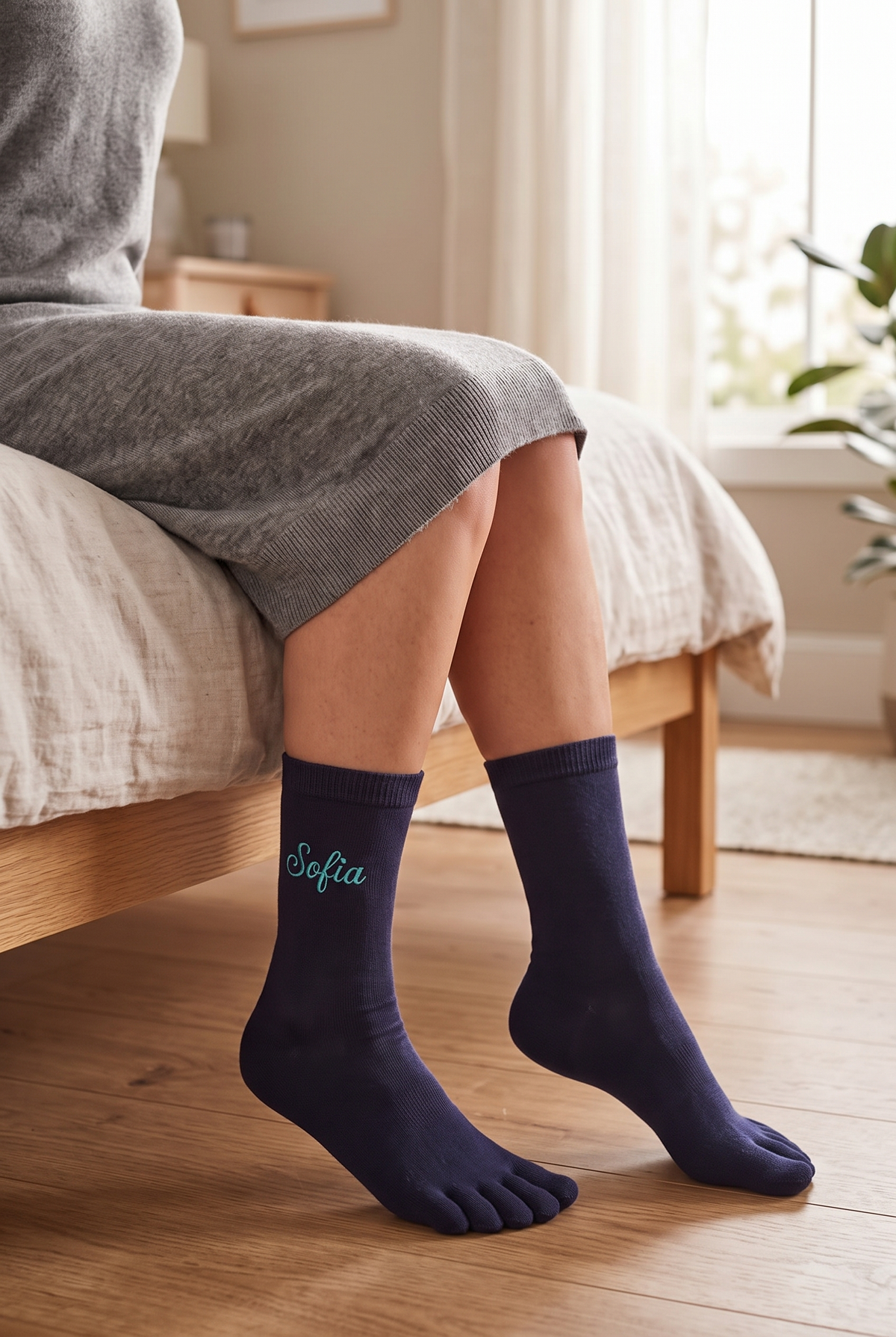 Model wearing navy embroidered toe socks, seen from the side