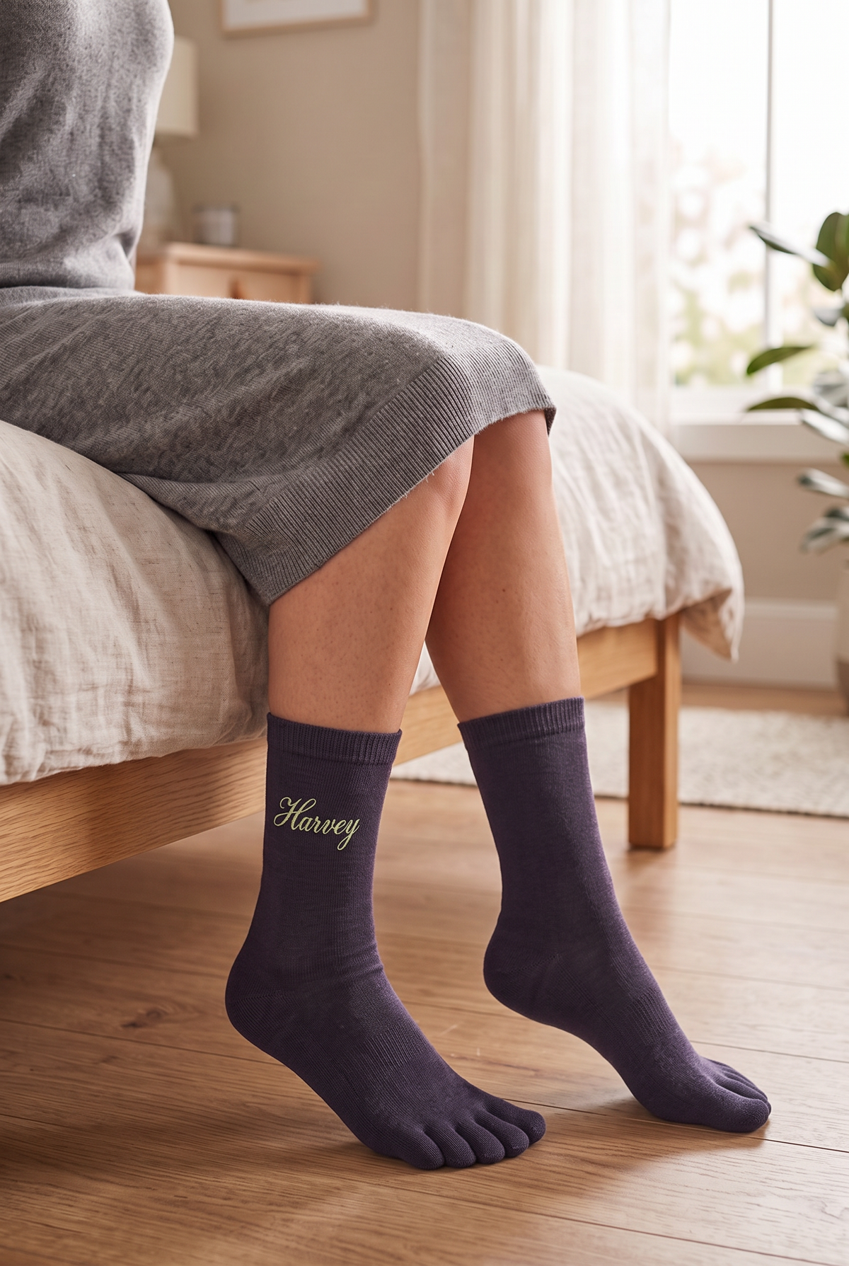 Model wearing black embroidered toe socks, seen from the side
