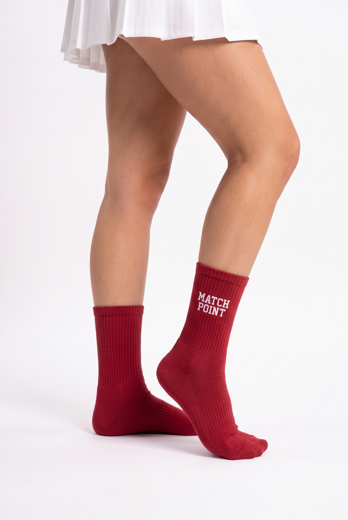 Model wearing red embroidered tennis socks