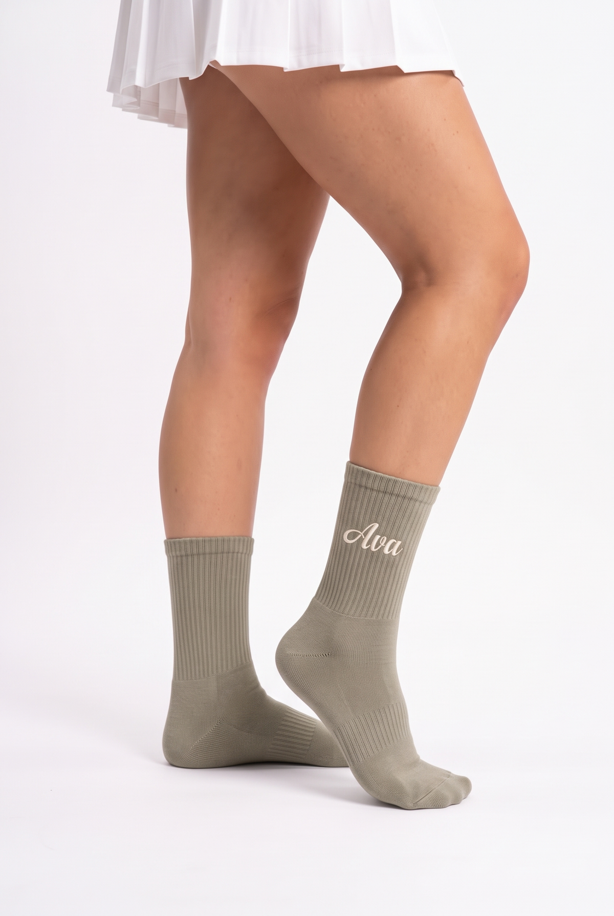 Model wearing khaki embroidered tennis socks
