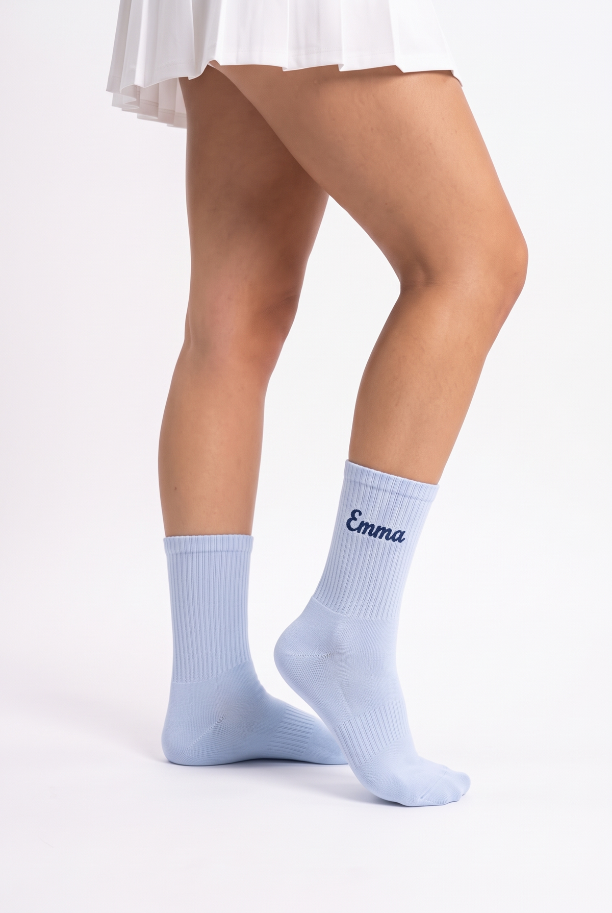 Model wearing baby blue embroidered tennis socks