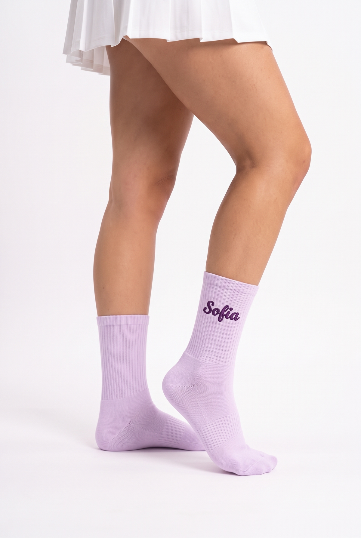 Model wearing lavender embroidered tennis socks