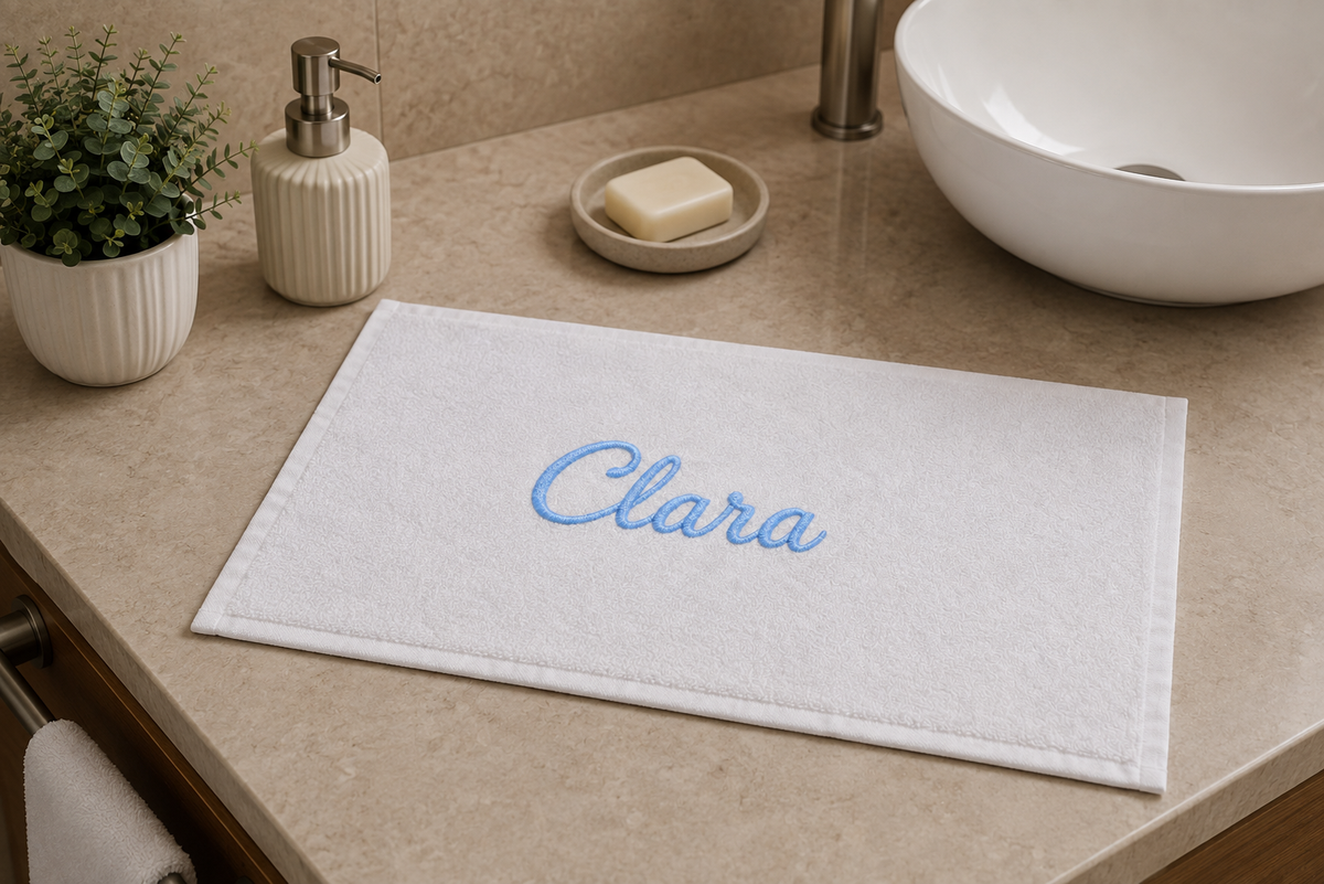 Clara personalized bamboo hand towel, sky blue script embroidery on white