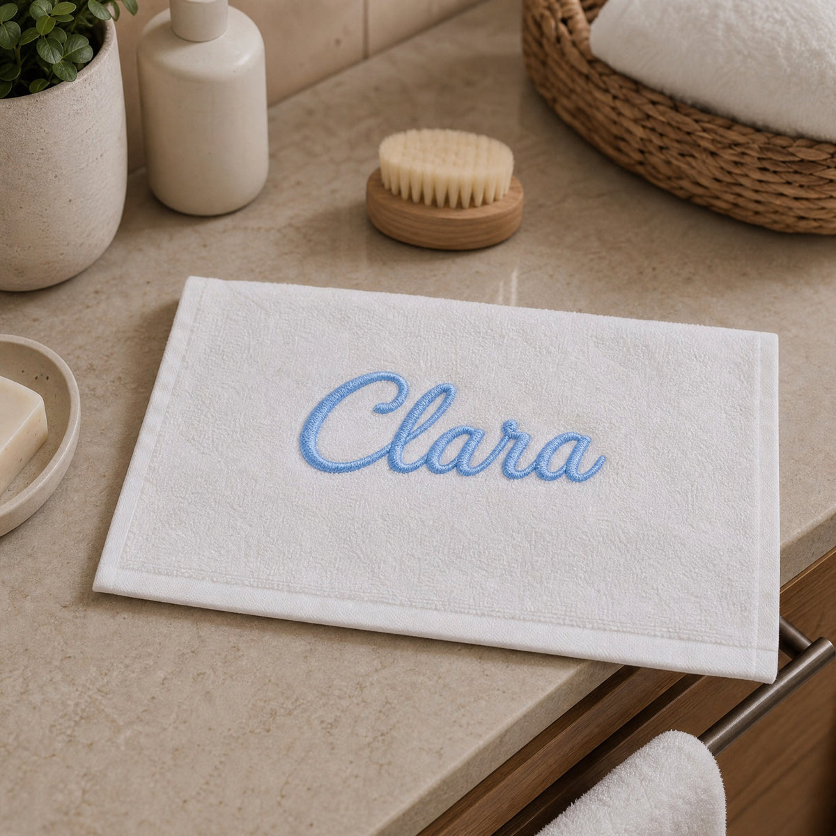 Clara personalized bamboo hand towel, sky blue script embroidery on white — photo 3