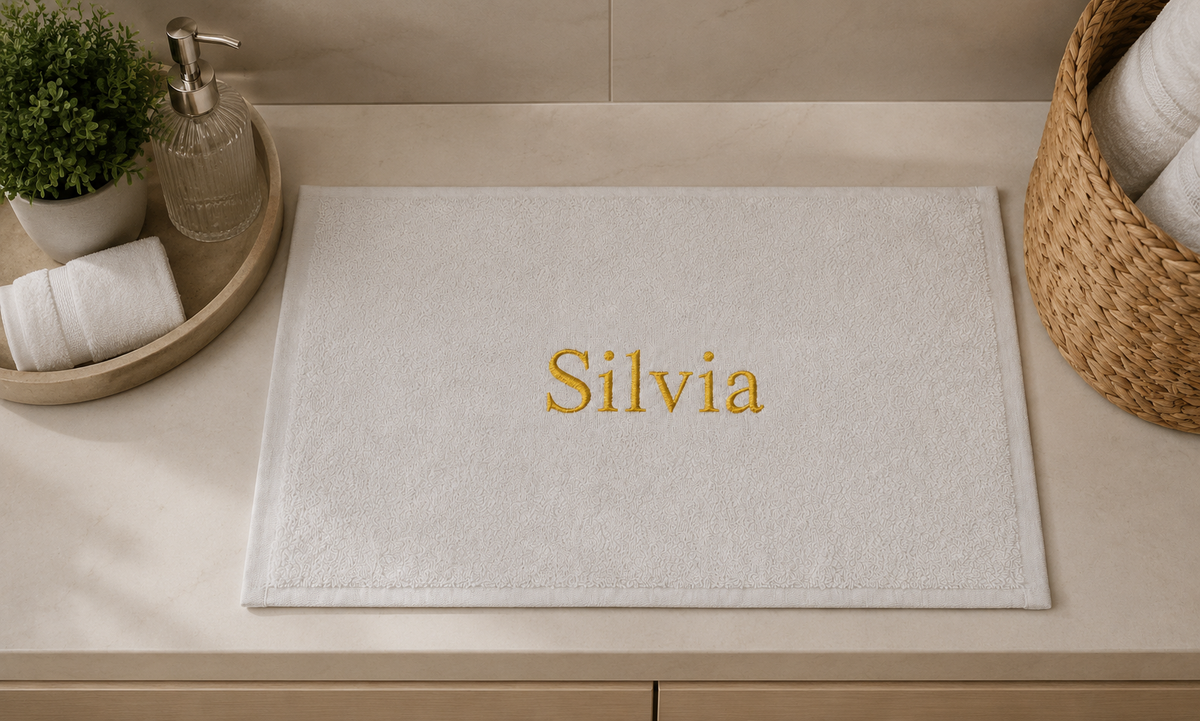 Silvia personalized bamboo hand towel, gold serif embroidery on white