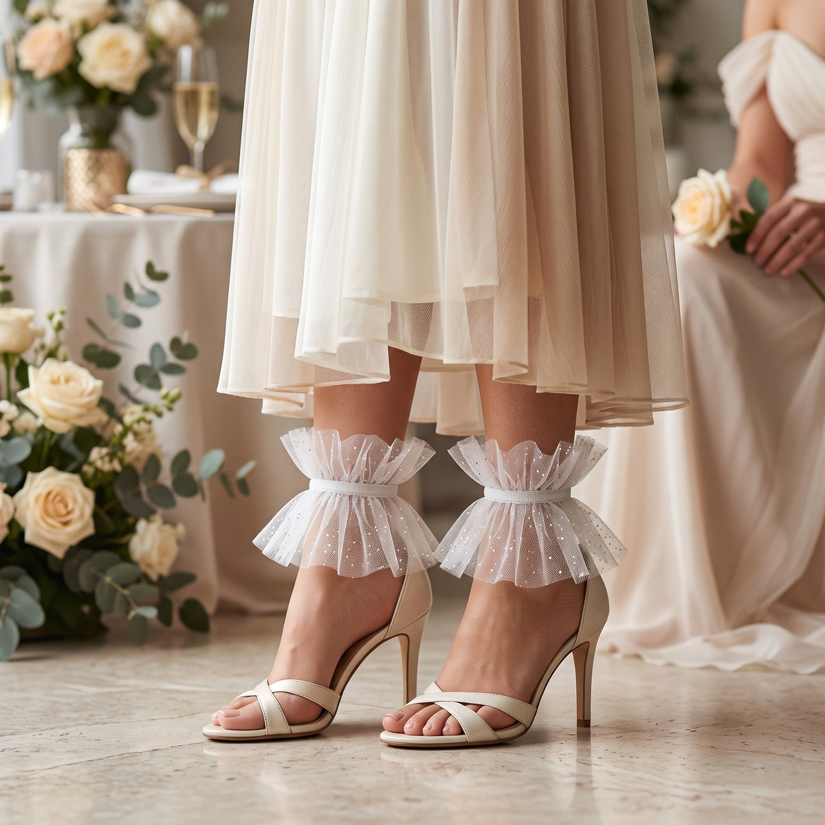 White Glitter Tulle Ruffle Ankle Cuffs, worn with nude sandals among wedding roses