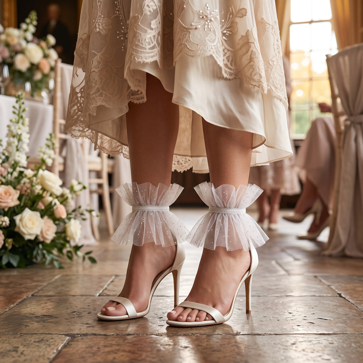White Glitter Tulle Ruffle Ankle Cuffs, worn with satin heels at a wedding reception