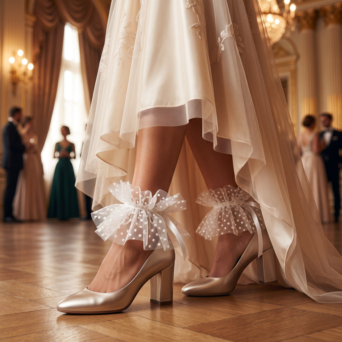 White Polka Dot Tulle Ankle Cuffs, worn with champagne heels in a candlelit ballroom
