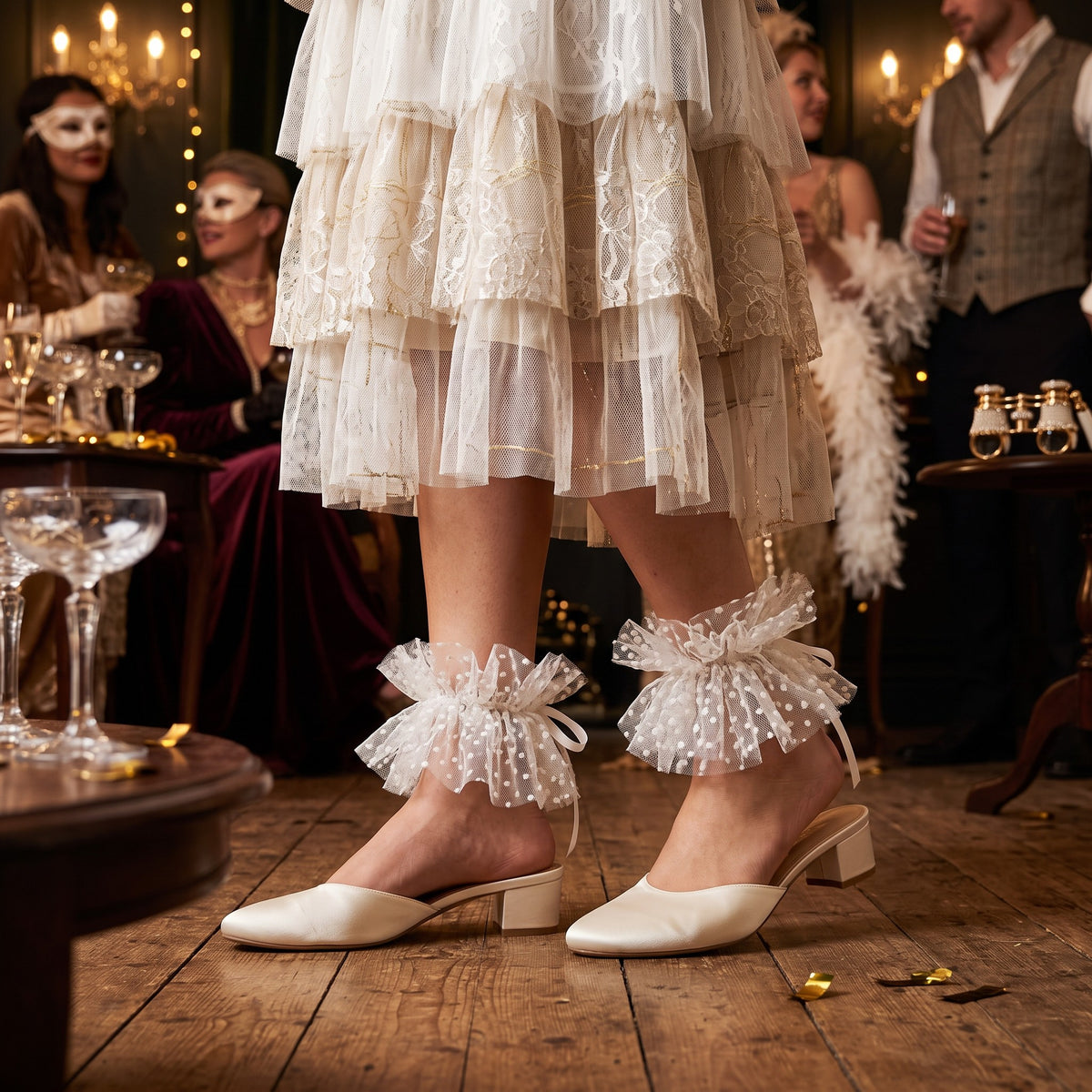 White Polka Dot Tulle Ankle Cuffs, worn with ivory block heels at a masquerade party