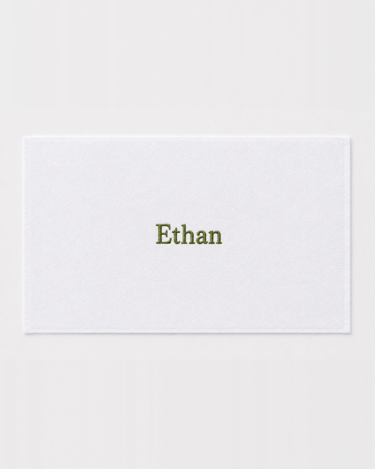 Ethan personalized bamboo hand towel, olive green serif embroidery on white