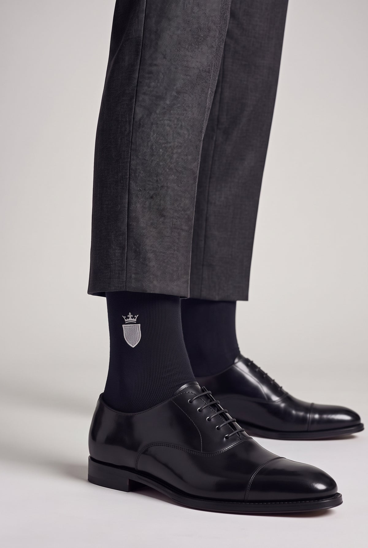 Black personalized embroidered plain dress socks, worn, second angle — made to order