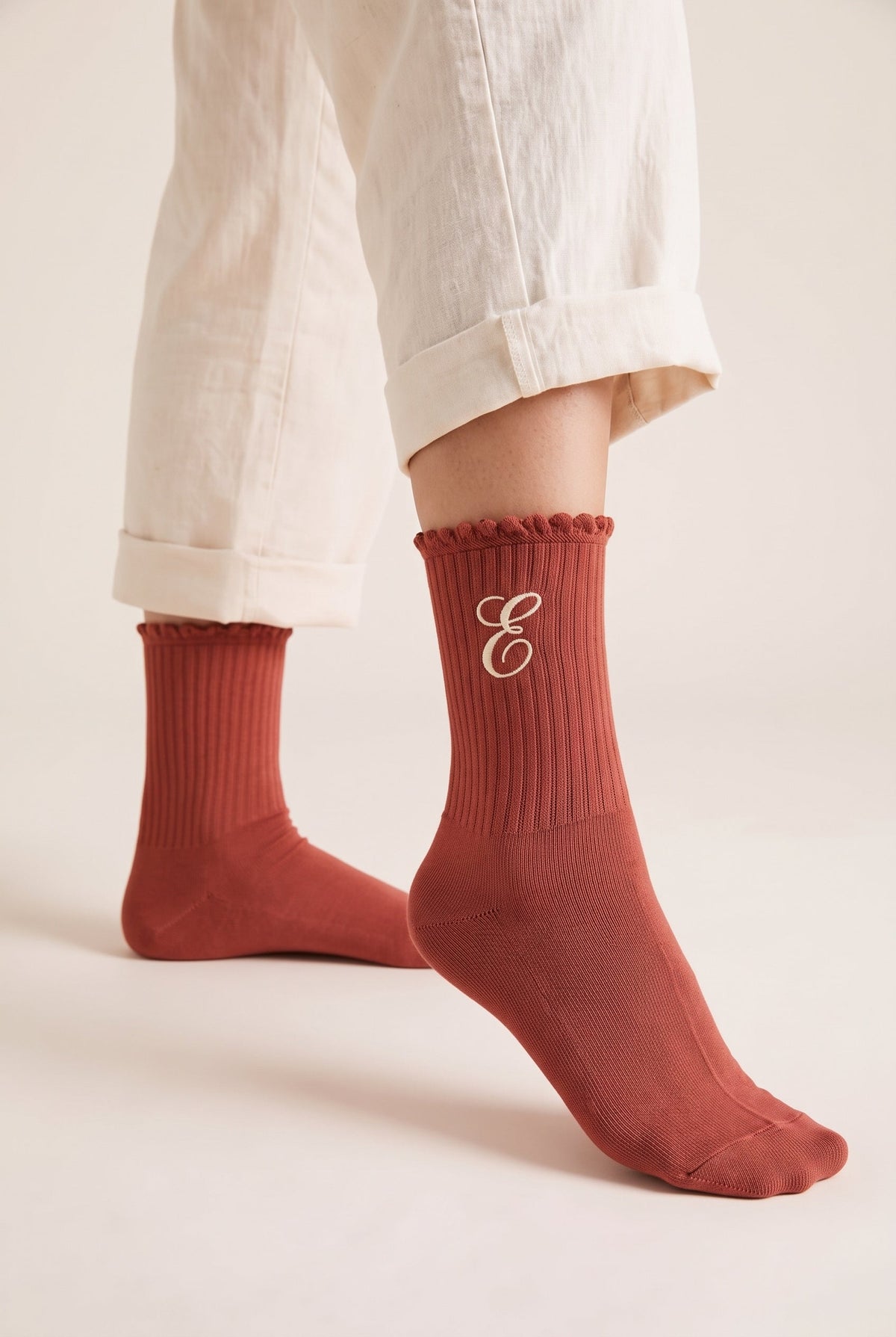 Terracotta personalized embroidered ruffle socks, worn, second angle — made to order