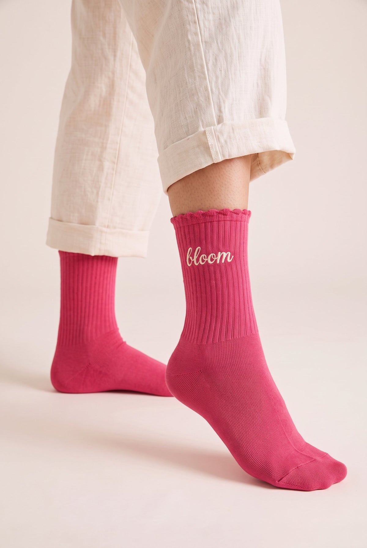 Red personalized embroidered ruffle socks, worn, second angle — made to order