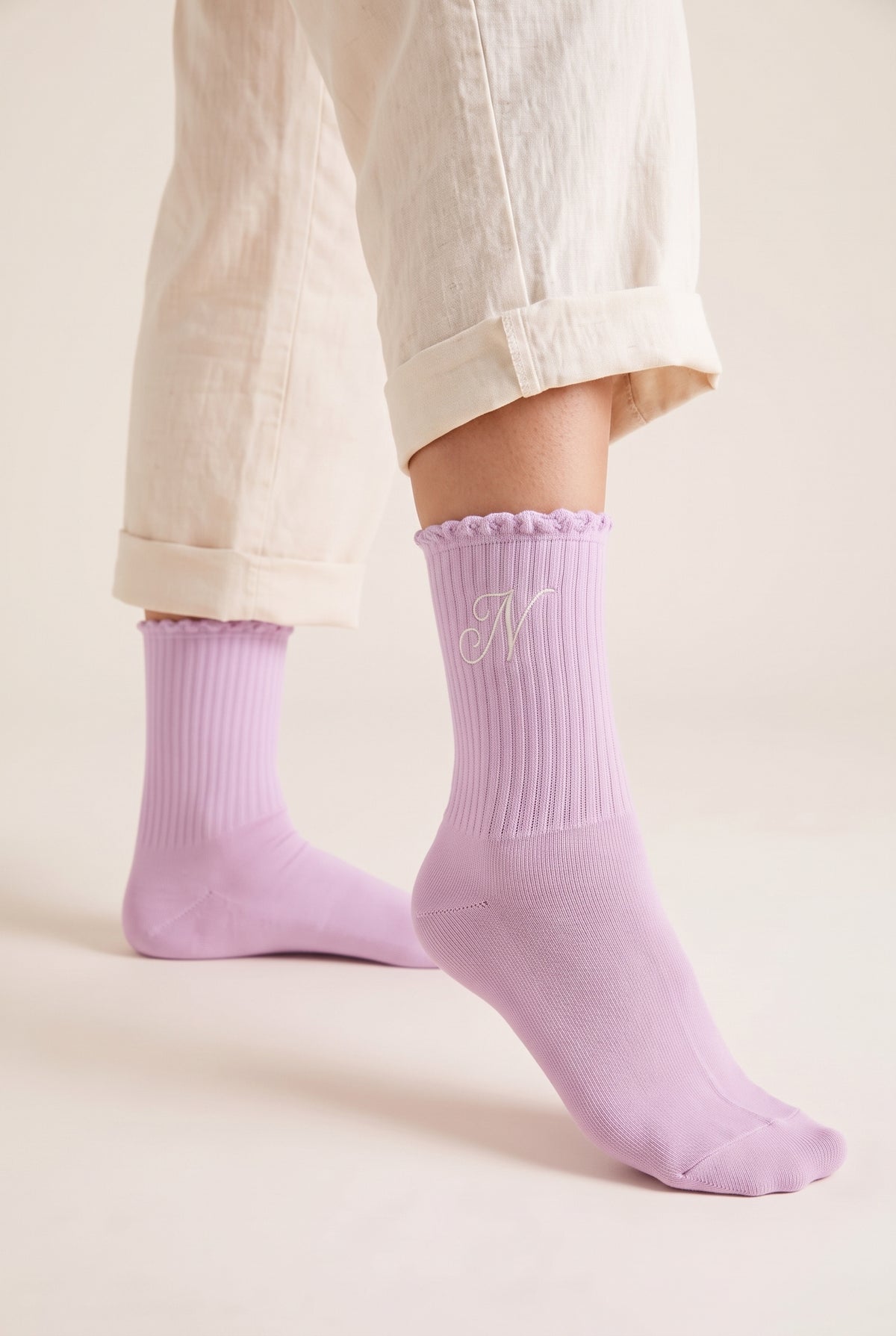 Lilac personalized embroidered ruffle socks, worn, second angle — made to order