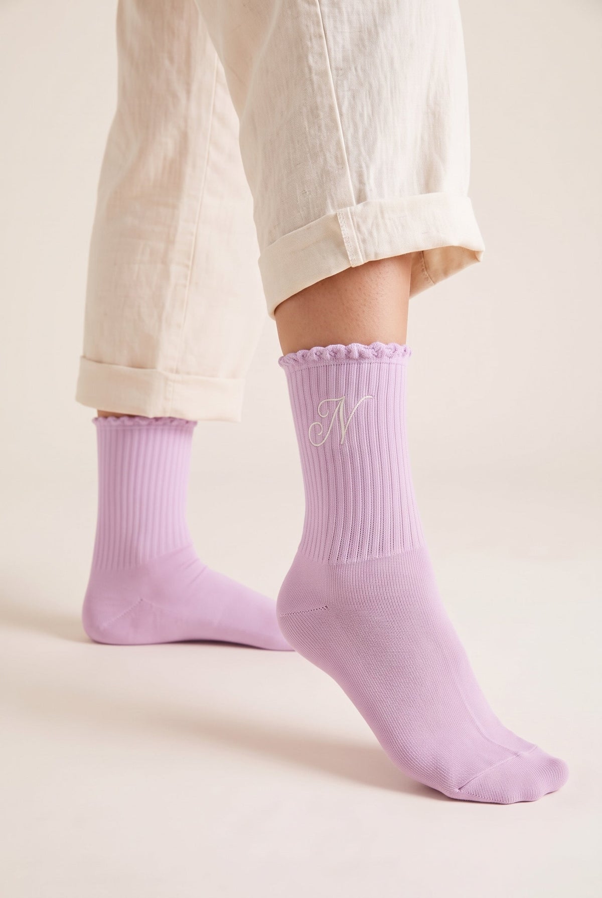 Lilac personalized embroidered ruffle socks, worn, second angle — made to order