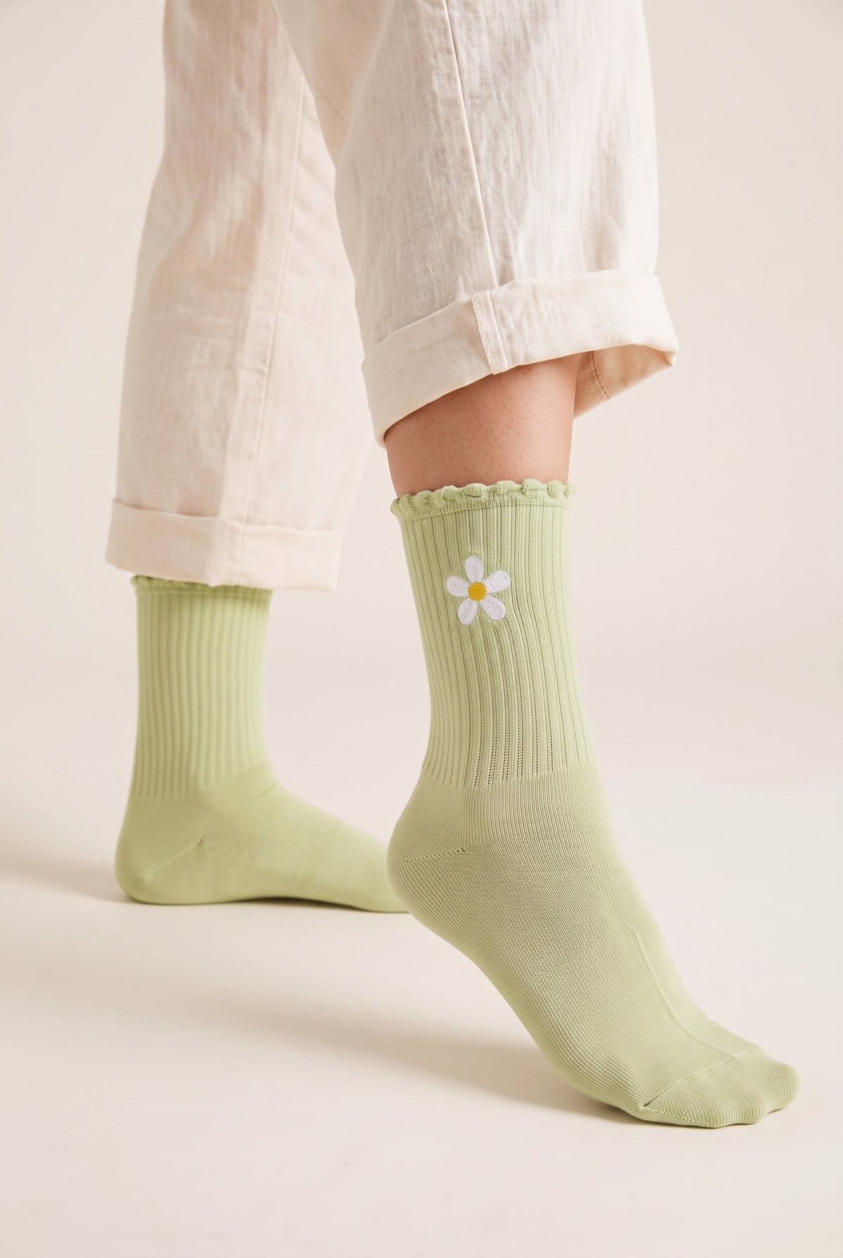 Pistachio personalized embroidered ruffle socks, worn, second angle — made to order