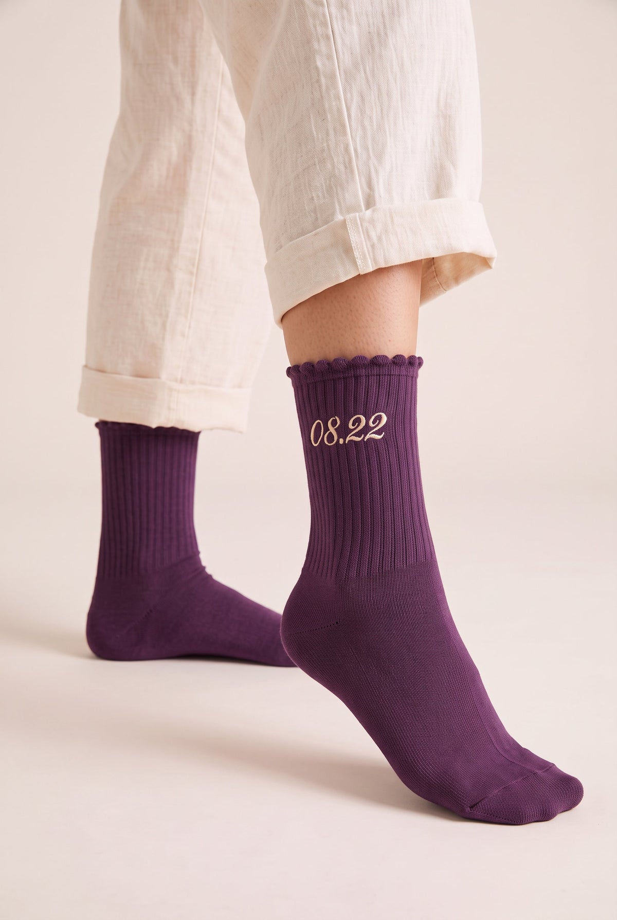 Plum personalized embroidered ruffle socks, worn, second angle — made to order