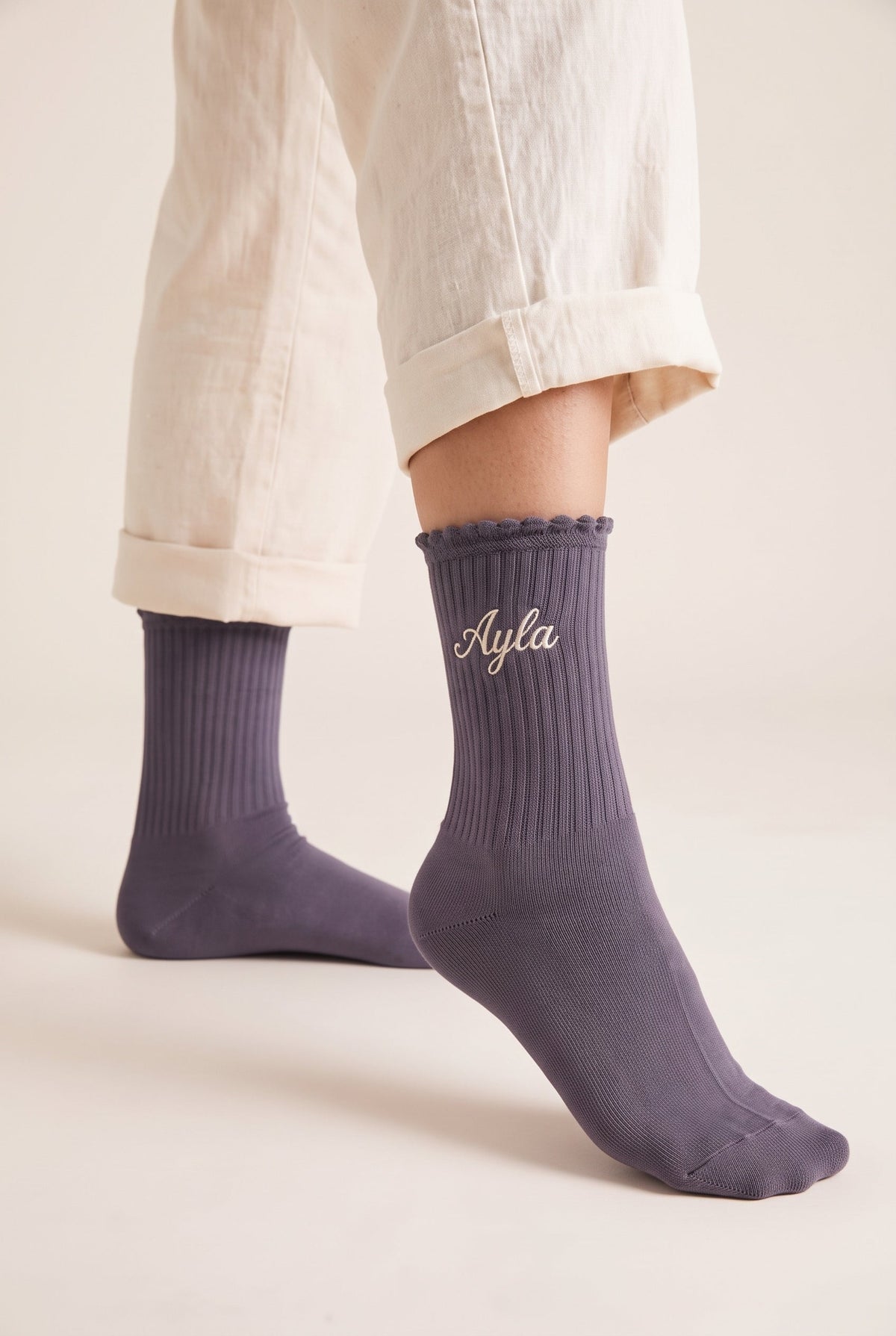 Charcoal personalized embroidered ruffle socks, worn, second angle — made to order