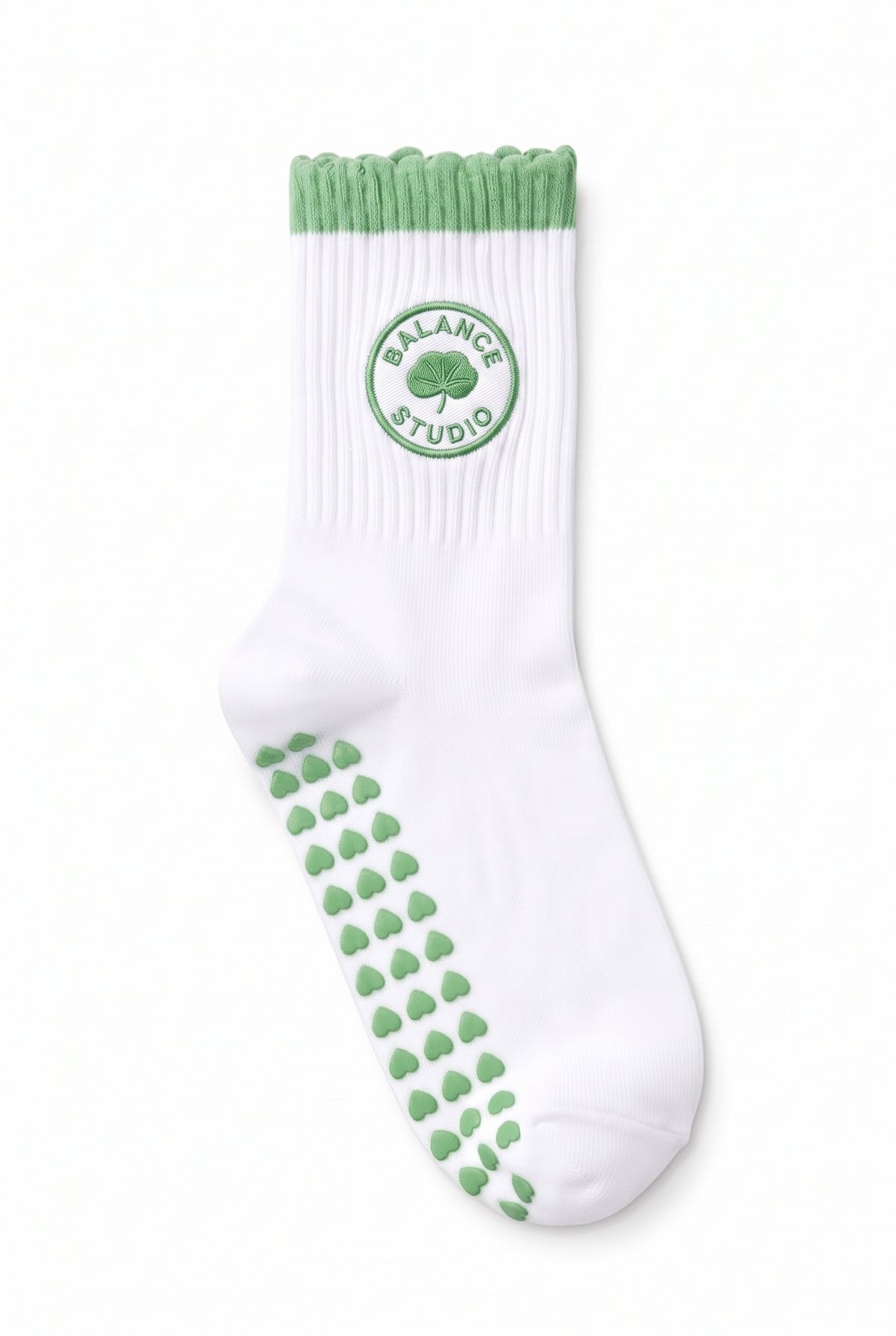 Green ruffle pilates grip socks, close-up of the custom embroidery on the ankle — embroidered to order